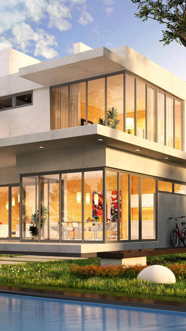 房屋 桌布 壁紙 — 現代混凝土房屋，落地玻璃窗在藍天白雲下溫暖發光。