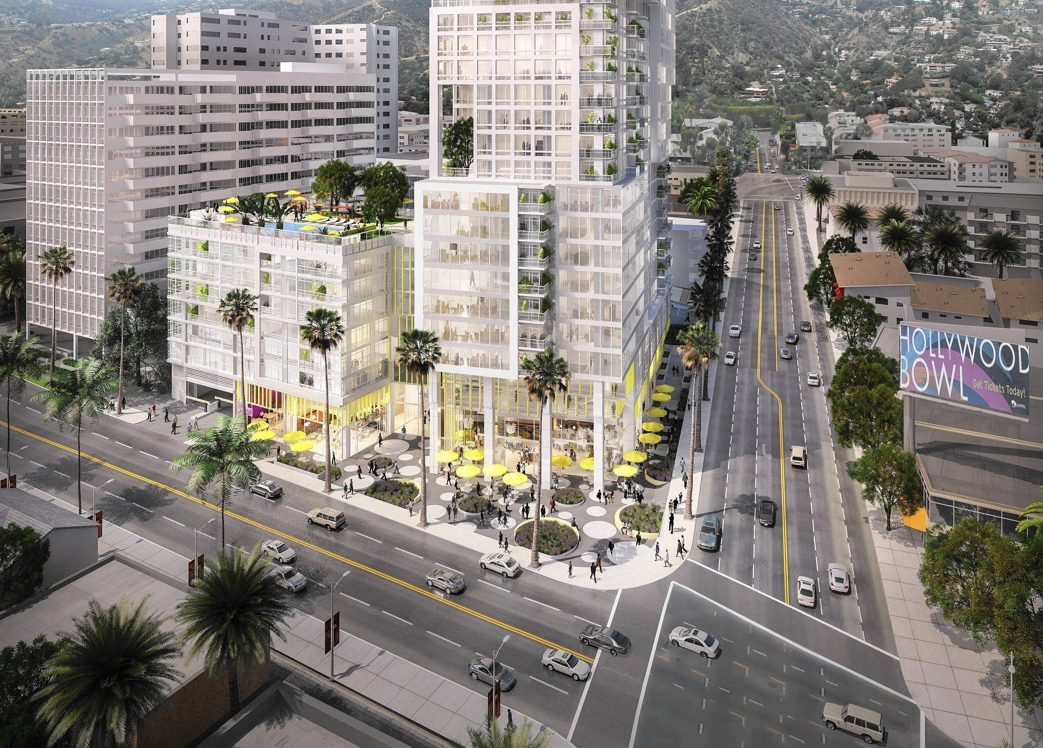 hollywood street 桌布 壁紙 — 現代玻璃摩天大樓設有屋頂花園和黃色雨傘，排列在好萊塢碗附近一條棕櫚樹成蔭的街道上。