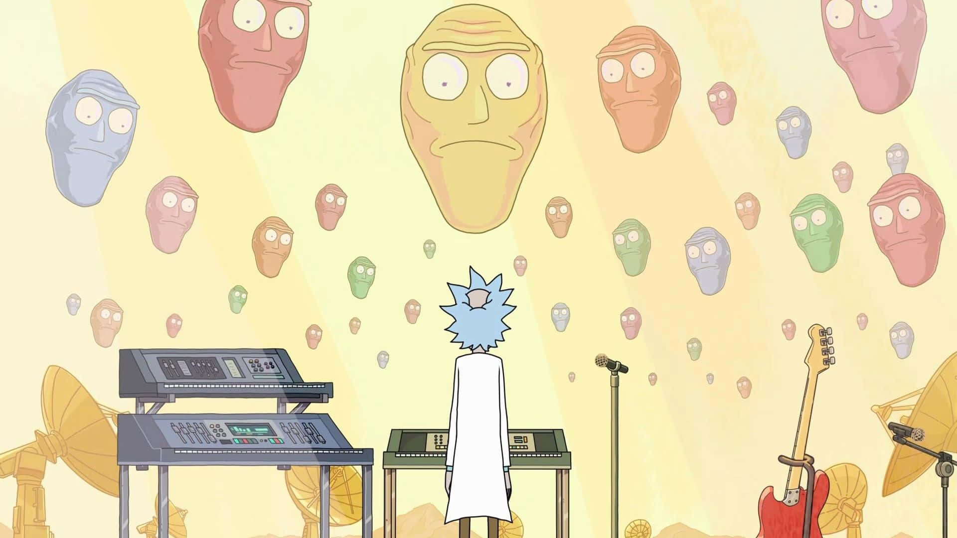 Giant Heads 桌布 壁紙 — 瑞克·桑切斯站在漂浮的外星人頭顱前，身處一個沐浴在溫暖黃光中的超現實動畫音樂工作室。