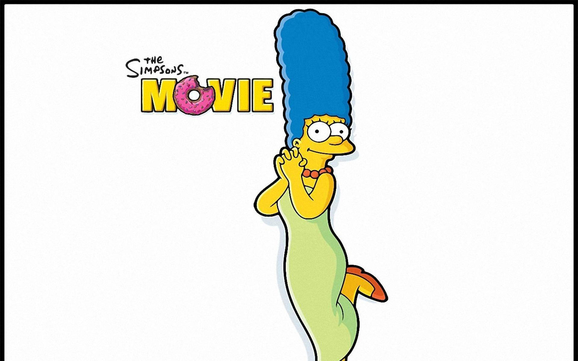 marge 桌布 壁紙 — 瑪吉·辛普森化身美人魚，擁有藍色蜂巢髮型和綠色尾巴，在純白背景前愉快地擺姿勢。