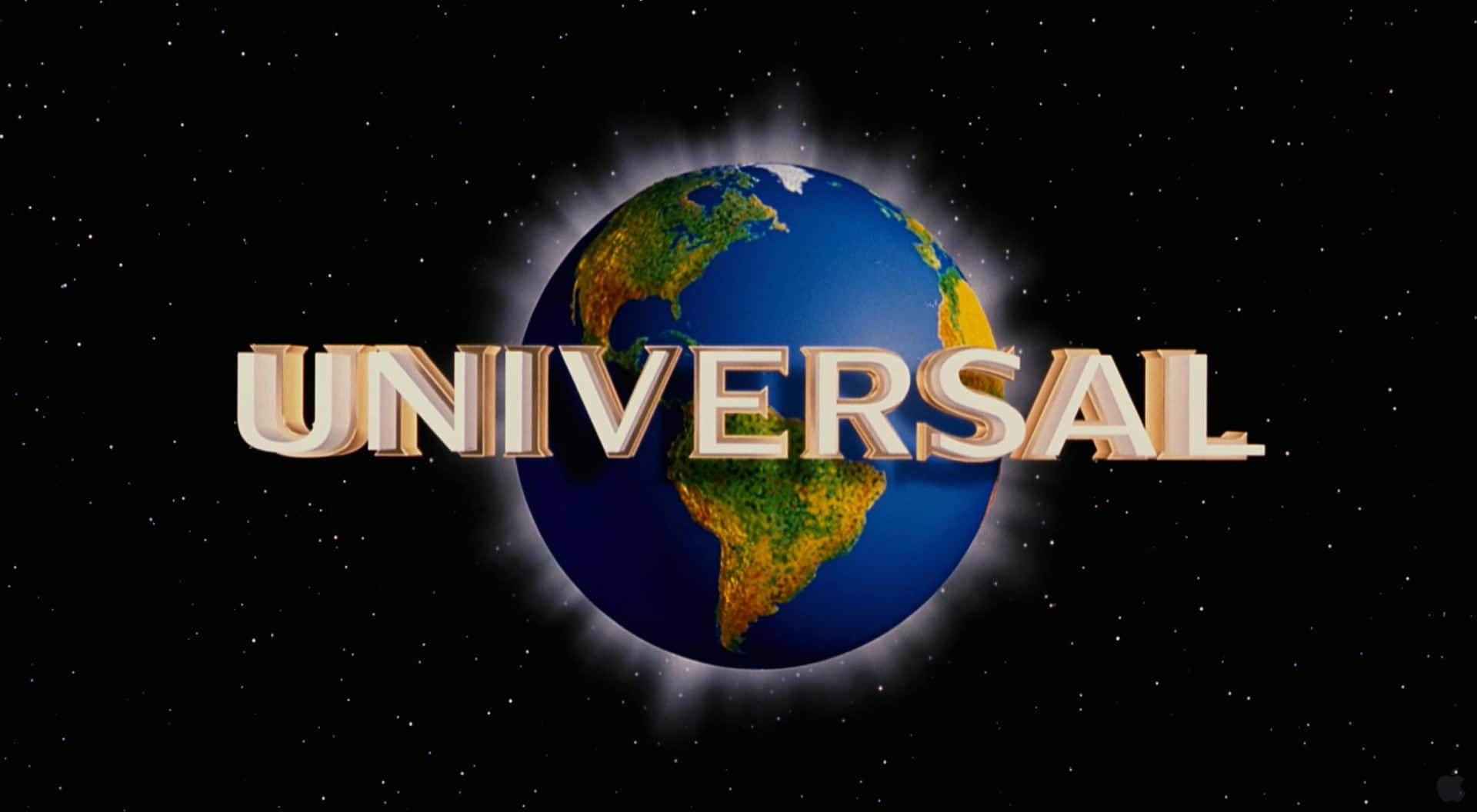 Universal 桌布 壁紙 — 環球影業標誌以金色字母在繁星點點的黑色天空中發光，背後有一個細節豐富的藍色和綠色地球。