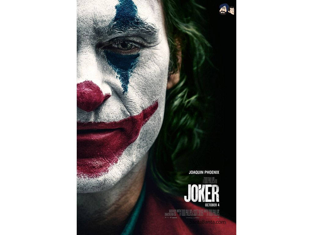 Joker 2019 桌布 壁紙 — 瓦昆菲尼克斯飾演的小丑特寫，臉上塗抹白色顏料、紅唇和綠髮，背景陰暗。