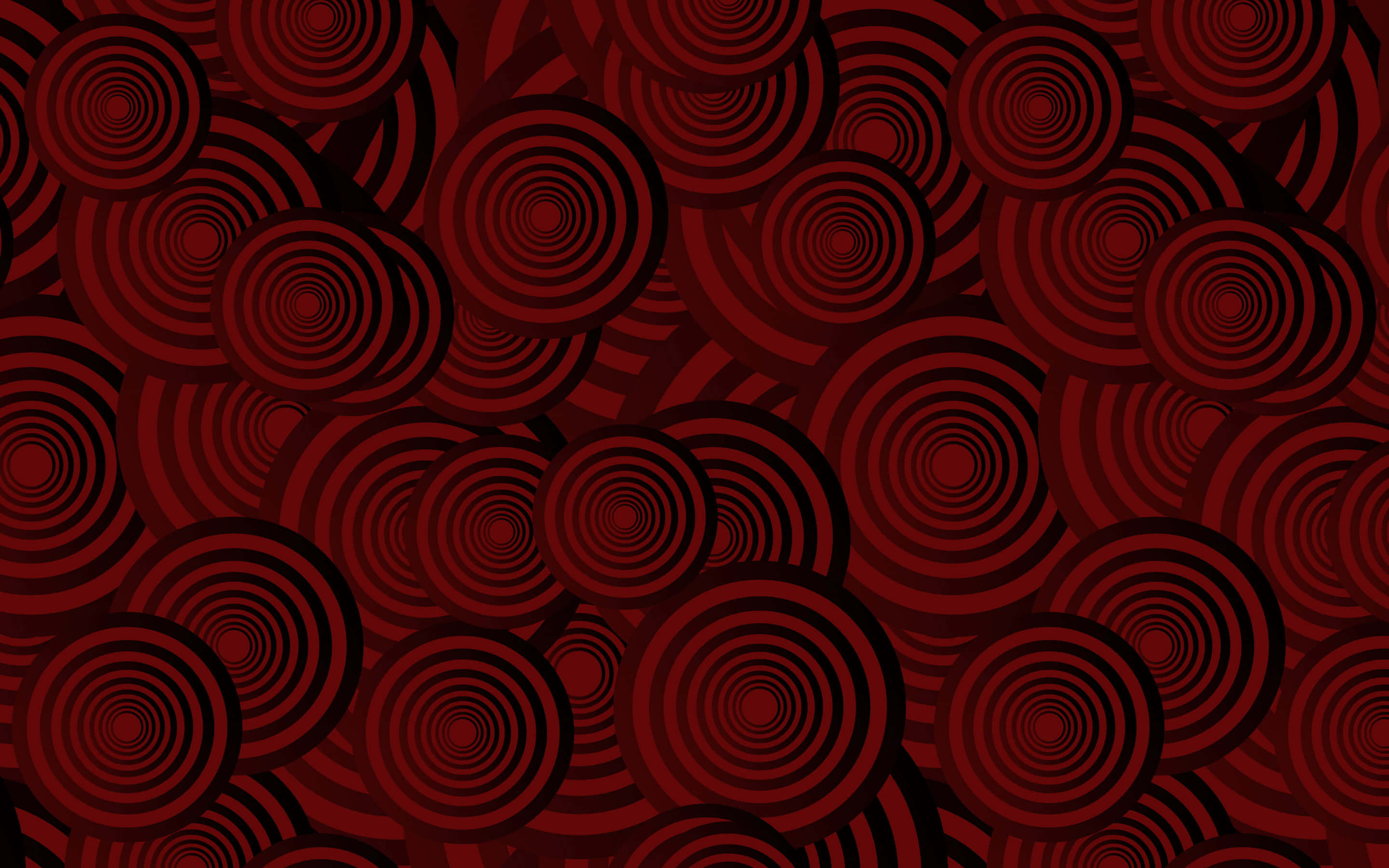 Dark Red Aesthetic 桌布 壁紙 — 由不同深淺的紅色重疊同心圓組成的催眠圖案，營造出動態的視覺節奏。