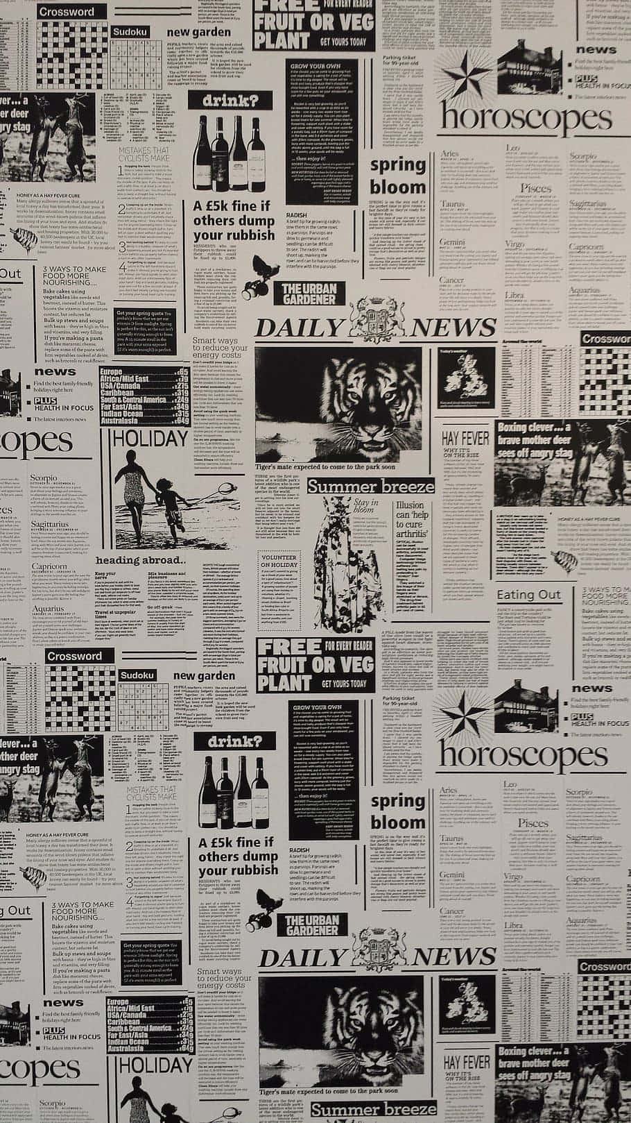 Vintage Newspaper 桌布 壁紙 — 由報紙剪報組成的密集拼貼，包含標題、謎題和文章，採用單色印刷。
