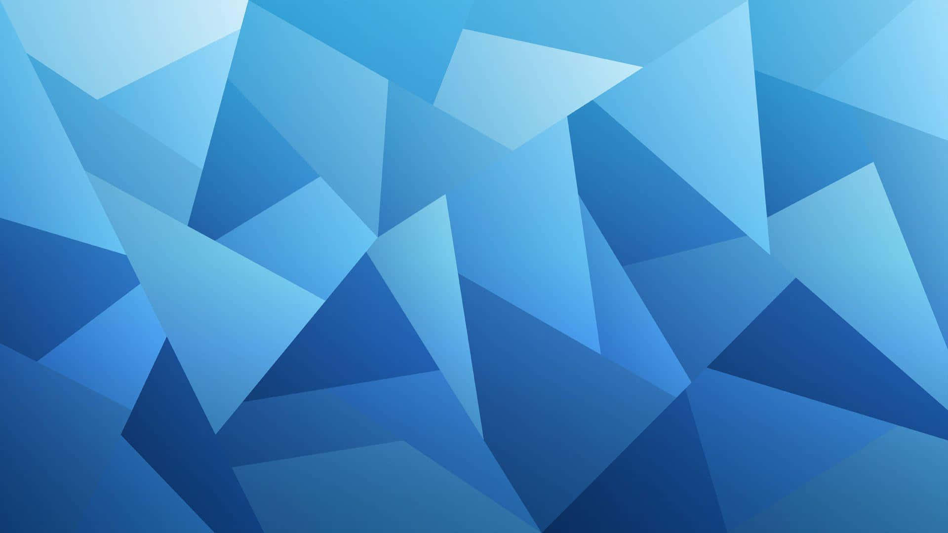 Blue Geometric 桌布 壁紙 — 由層疊藍色三角形組成的動態抽象構圖，創造出現代幾何圖案。