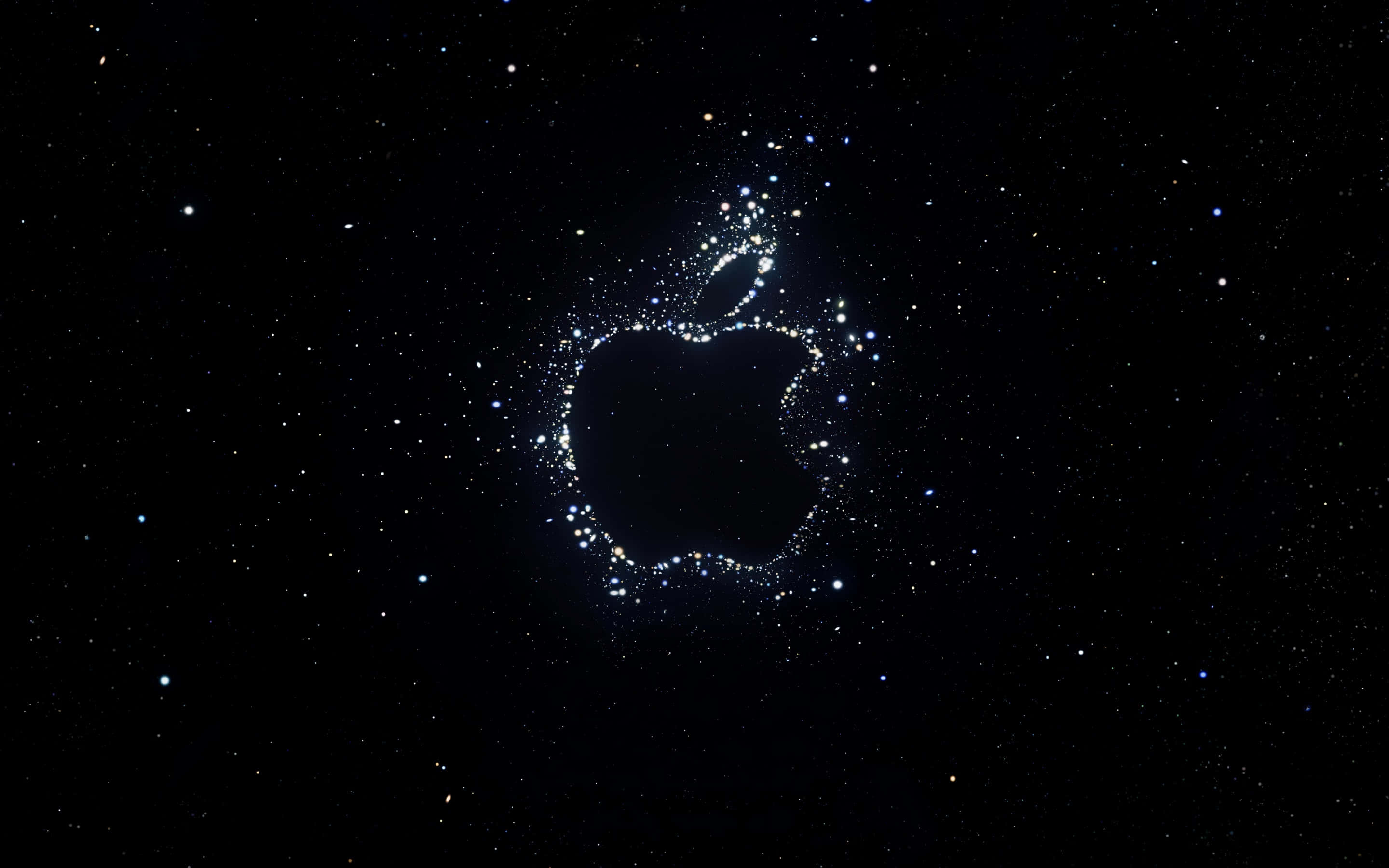 蘋果 桌布 壁紙 — 由星星組成的發光Apple標誌，背景是深邃的黑色宇宙天空。