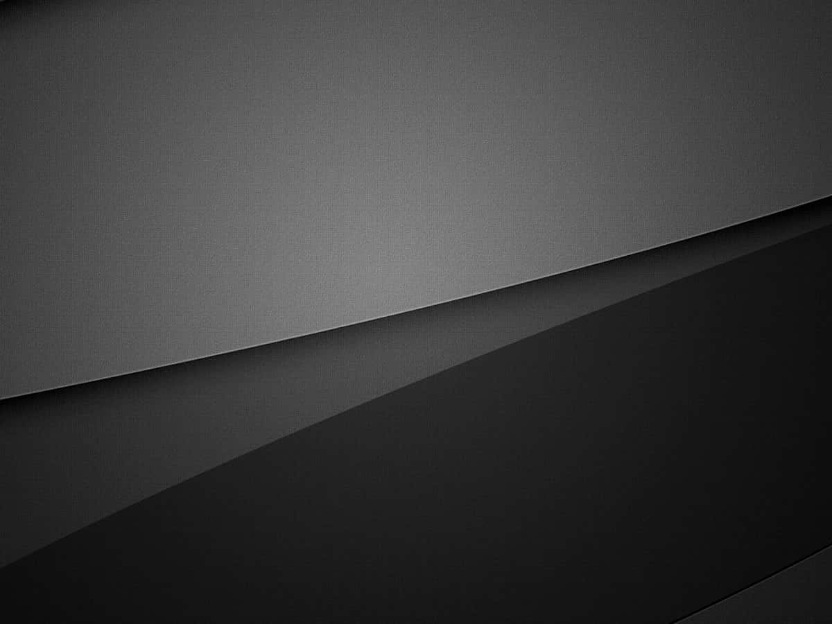 Black And Gray 桌布 壁紙 — 由深灰色和黑色層疊平面組成的極簡抽象構圖，帶有柔和漸變和細微紋理。