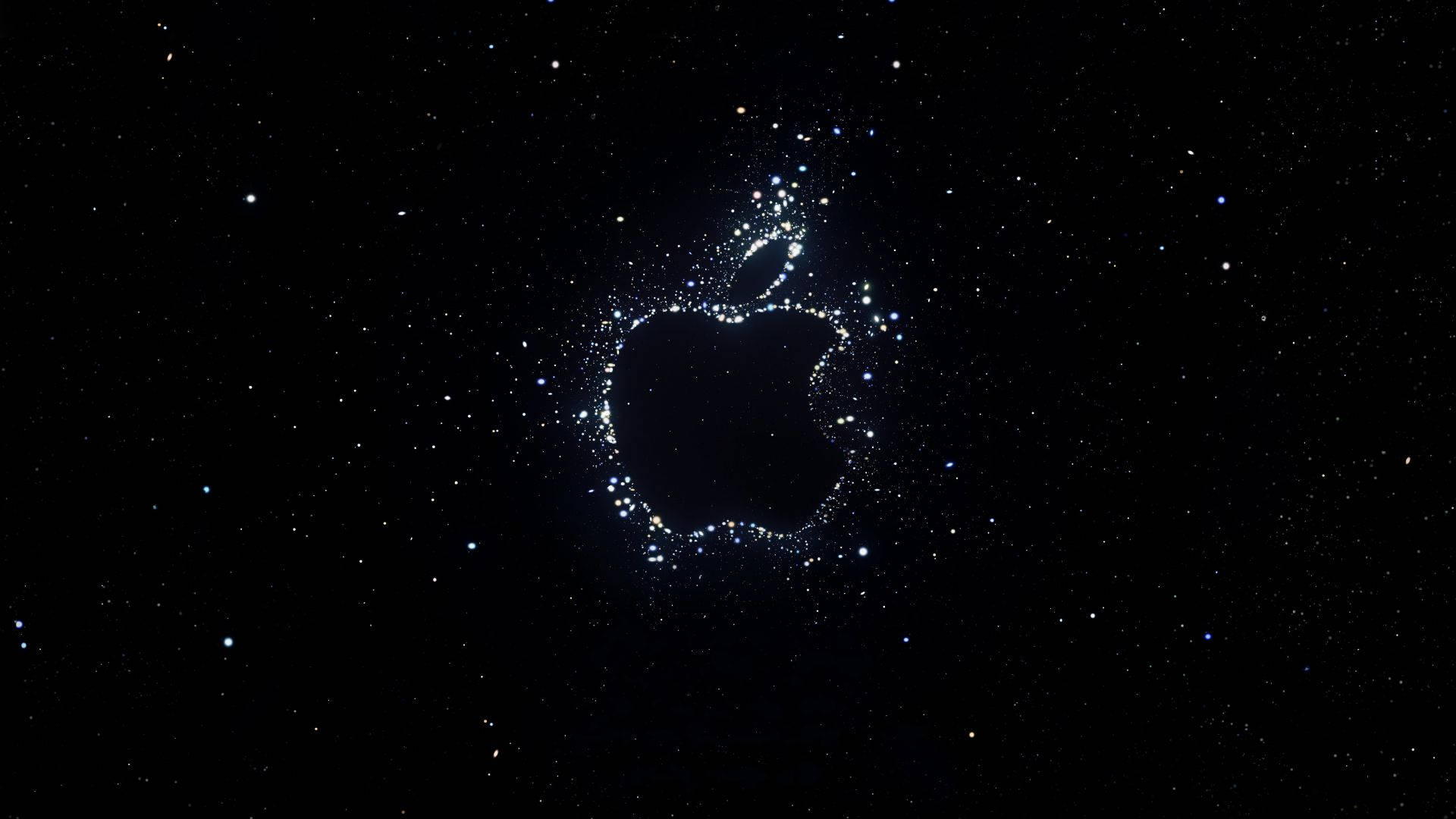 桌布 壁紙 — 由漂浮在星際宇宙虛空中的發光粒子形成的Apple標誌。