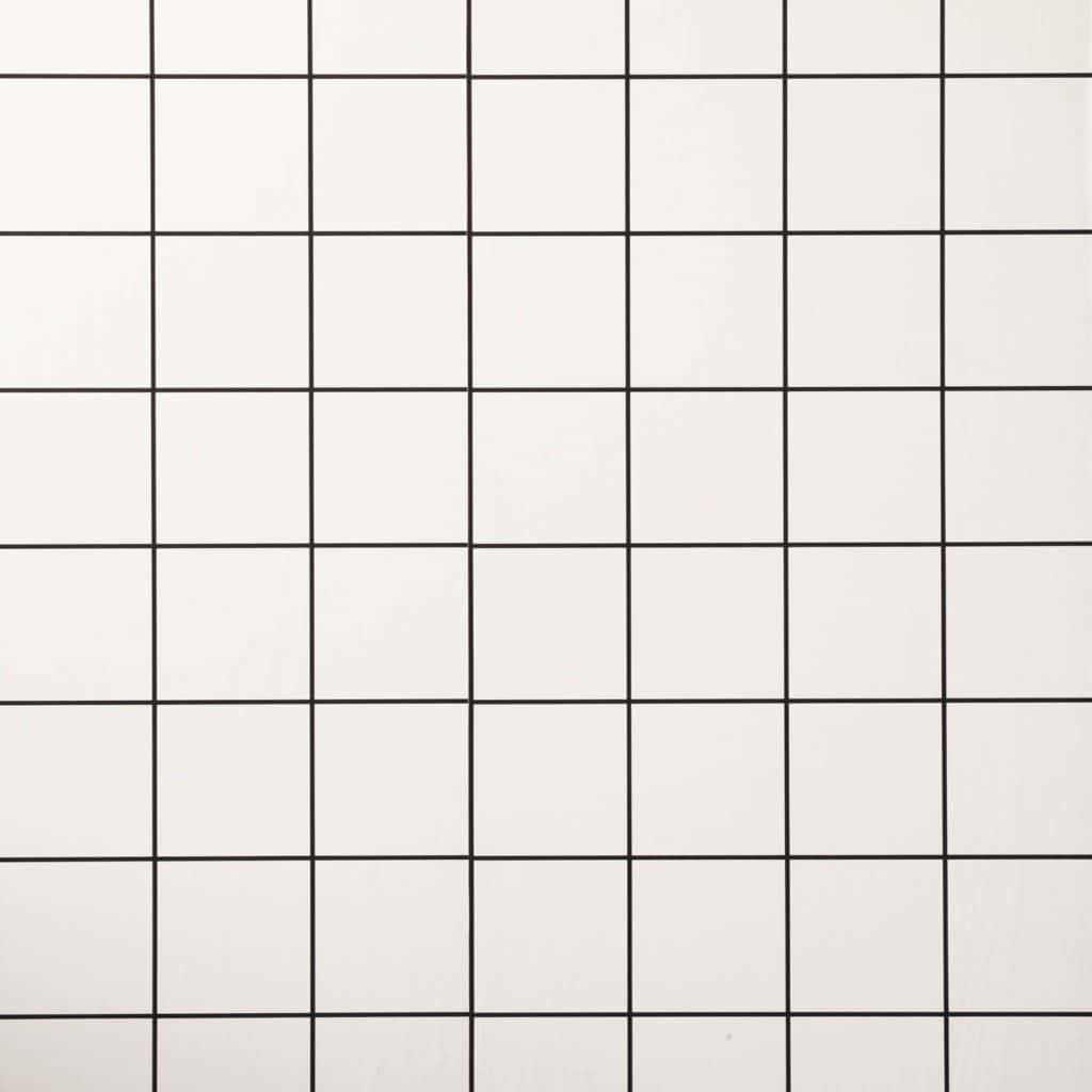 White Grid 桌布 壁紙 — 由白色正方形組成的極簡網格圖案，以細黑線分隔，營造出乾淨的幾何壁紙設計。