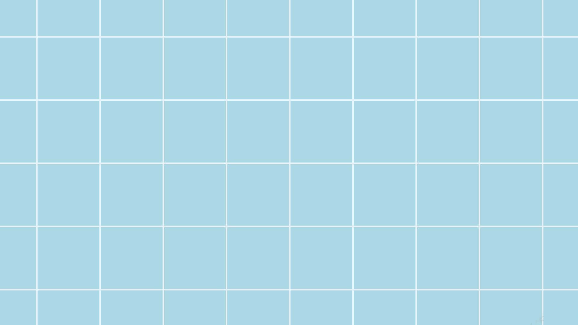 Pastel Blue Aesthetic Desktop 桌布 壁紙 — 由白色細線分隔的淺藍色正方形組成極簡網格，形成乾淨的幾何圖案。