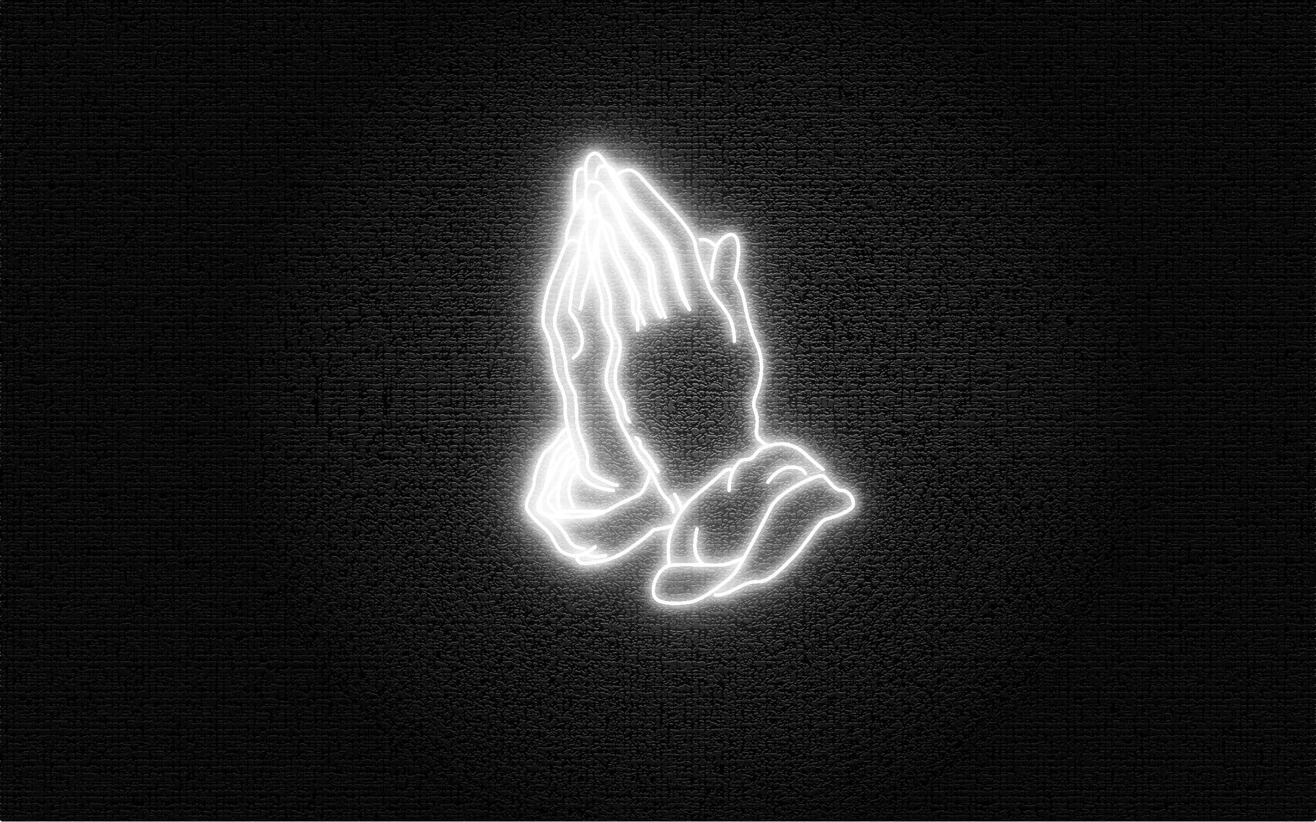 Praying 桌布 壁紙 — 發光白色霓虹輪廓的合十祈禱雙手，襯以紋理黑色背景。