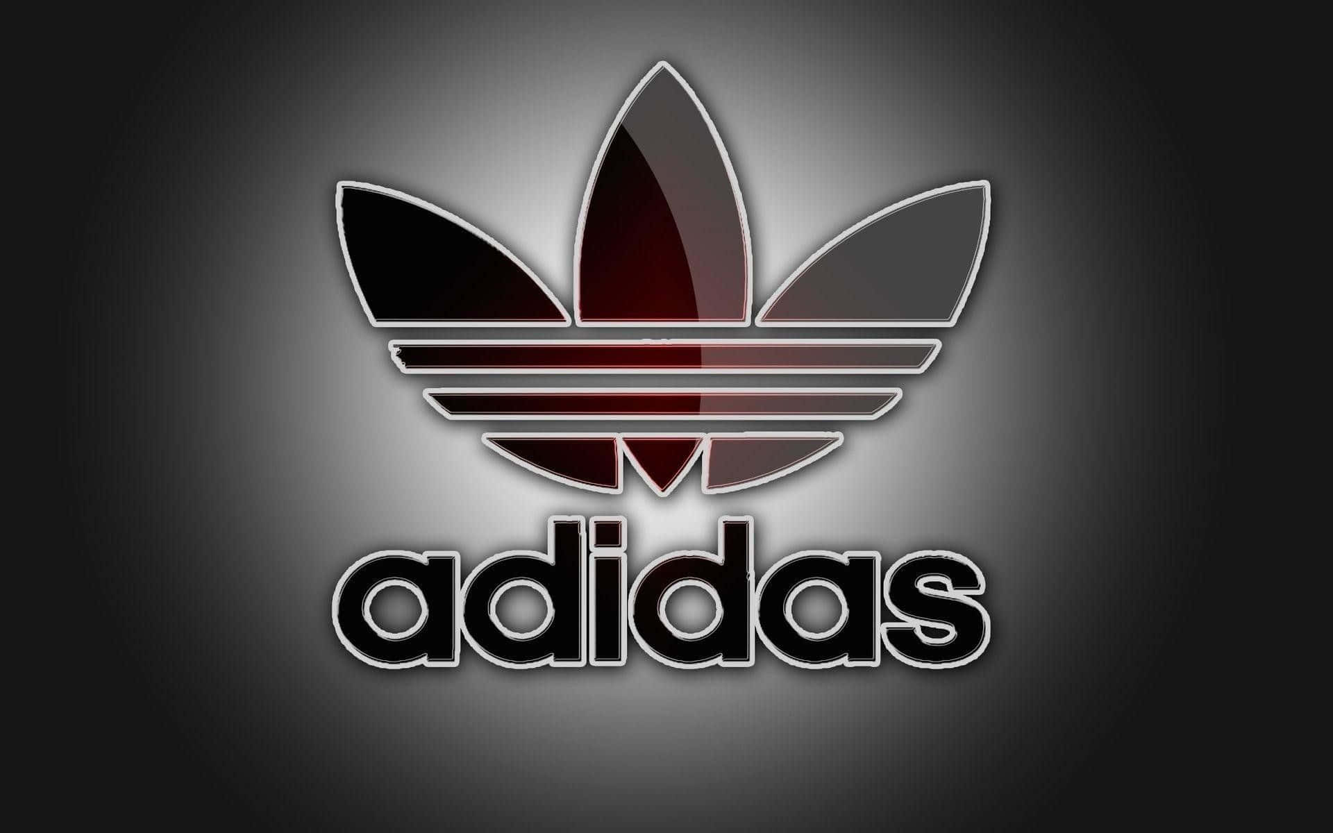 愛迪達 桌布 壁紙 — 發光的Adidas標誌，帶有紅色和黑色漸變三葉草圖案，背景為深灰色漸變。