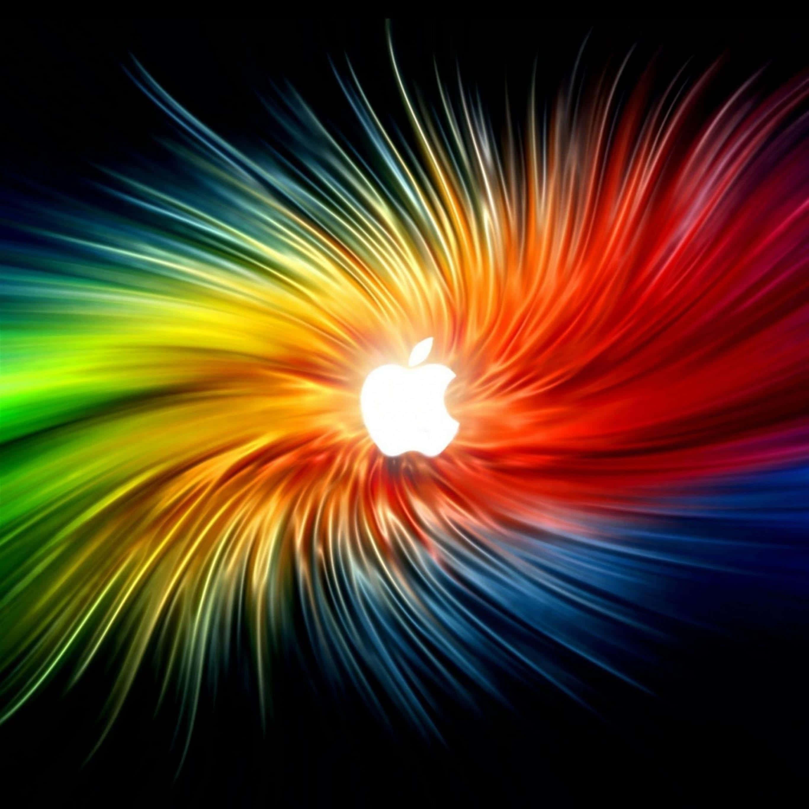 iPad Pro 桌布 壁紙 — 發光的Apple標誌在黑色背景上散發出鮮豔的彩虹條紋。