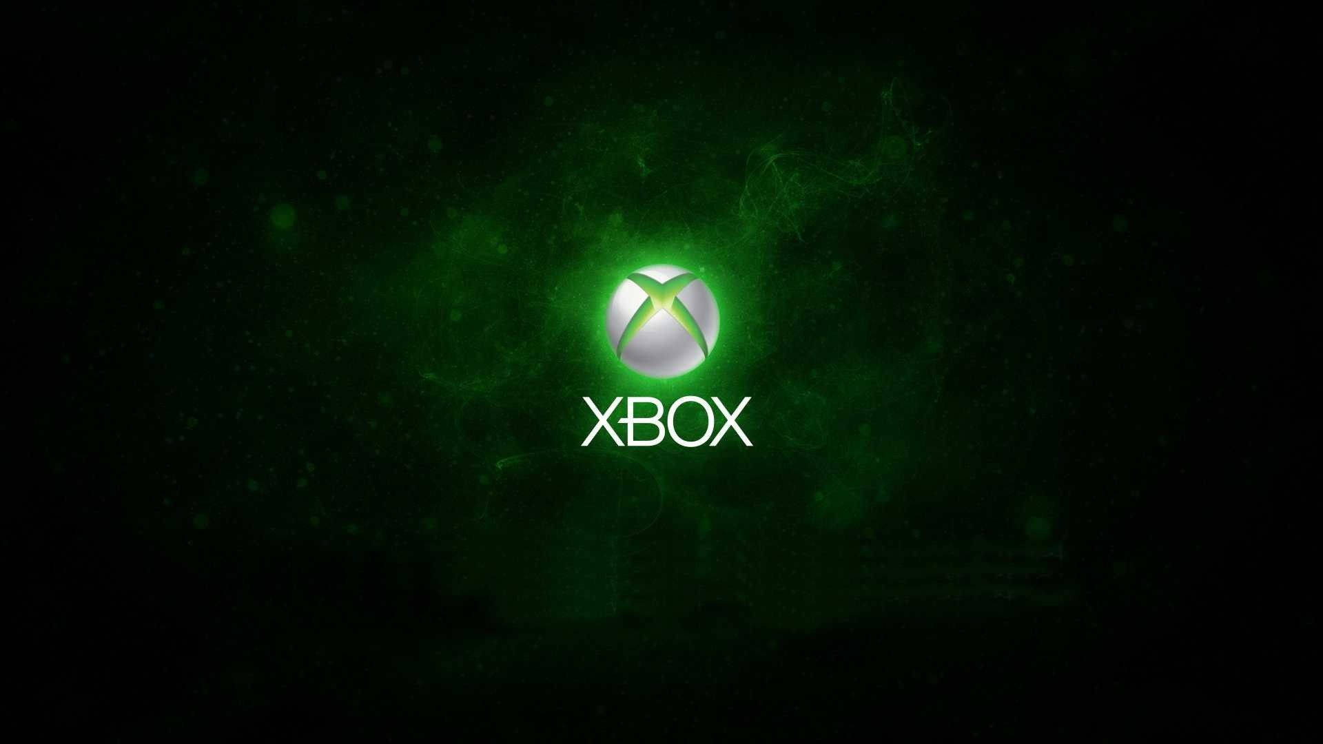Xbox 桌布 壁紙 — 發光的Xbox標誌在黑暗的宇宙背景下散發出鮮豔的綠色光芒，並帶有漂浮的粒子。