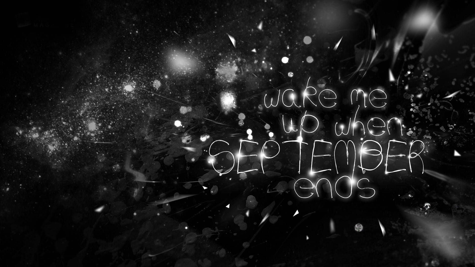 September 桌布 壁紙 — 發光的手寫文字顯示 wake me up when september ends，背景為深色抽象背景，帶有閃爍的粒子。
