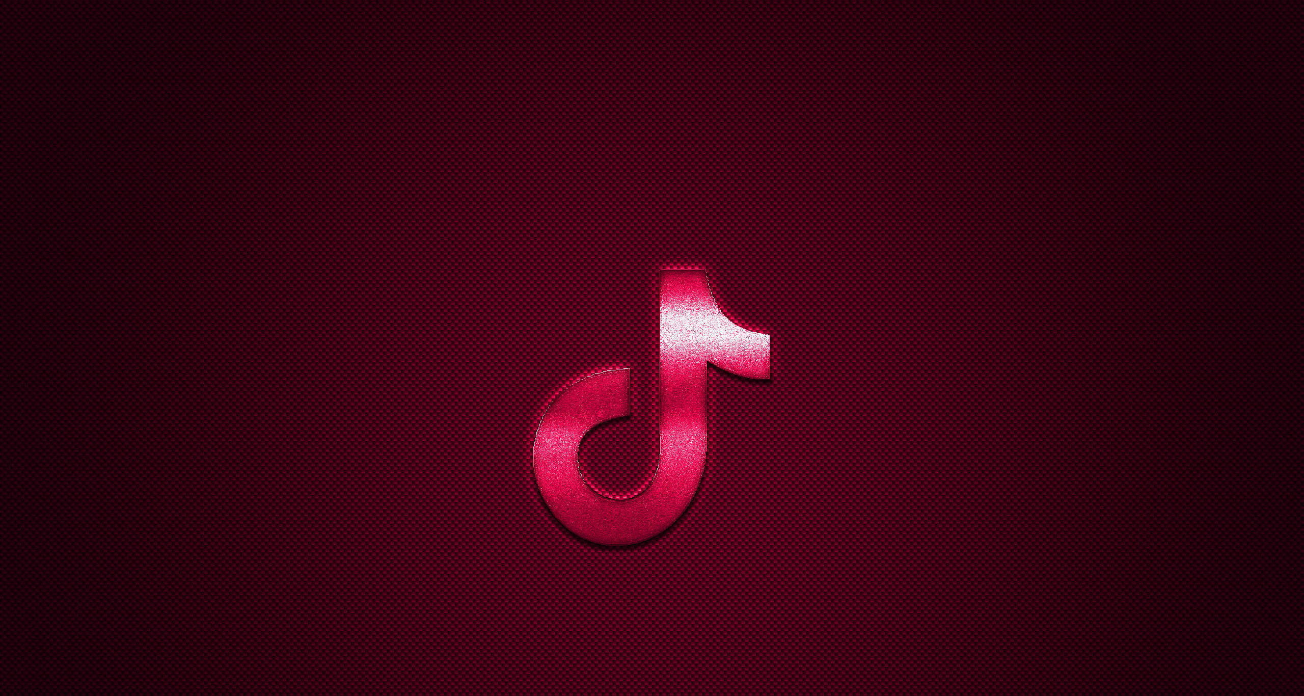 TikTok 動圖 桌布 壁紙 — 發光的紅色TikTok標誌居中在帶有紋理的深棗紅色背景上，帶有微妙的漸變照明。