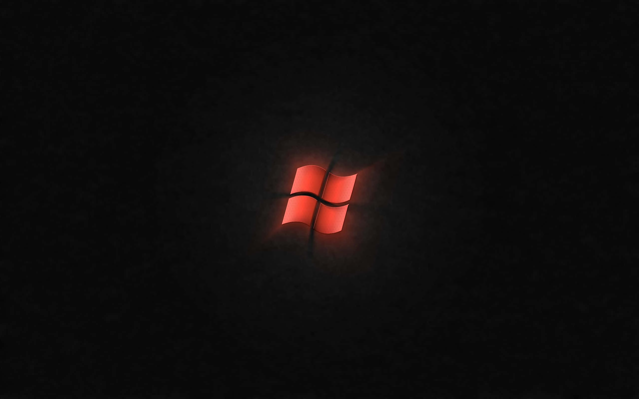 Black Windows 桌布 壁紙 — 發光的紅色Windows標誌在帶有紋理的黑色背景上柔和地發光。