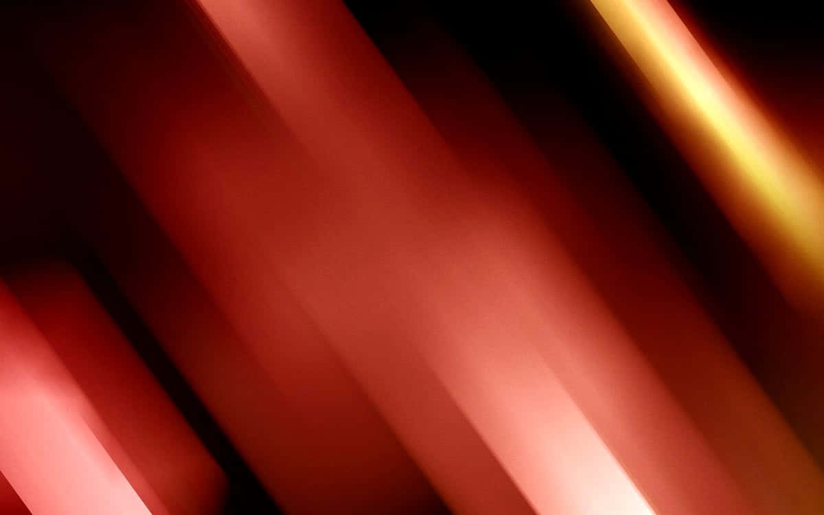 Beautiful Abstract 桌布 壁紙 — 發光的紅色和金色光線的對角線條紋在黑暗背景上模糊，營造出動態的抽象運動效果。