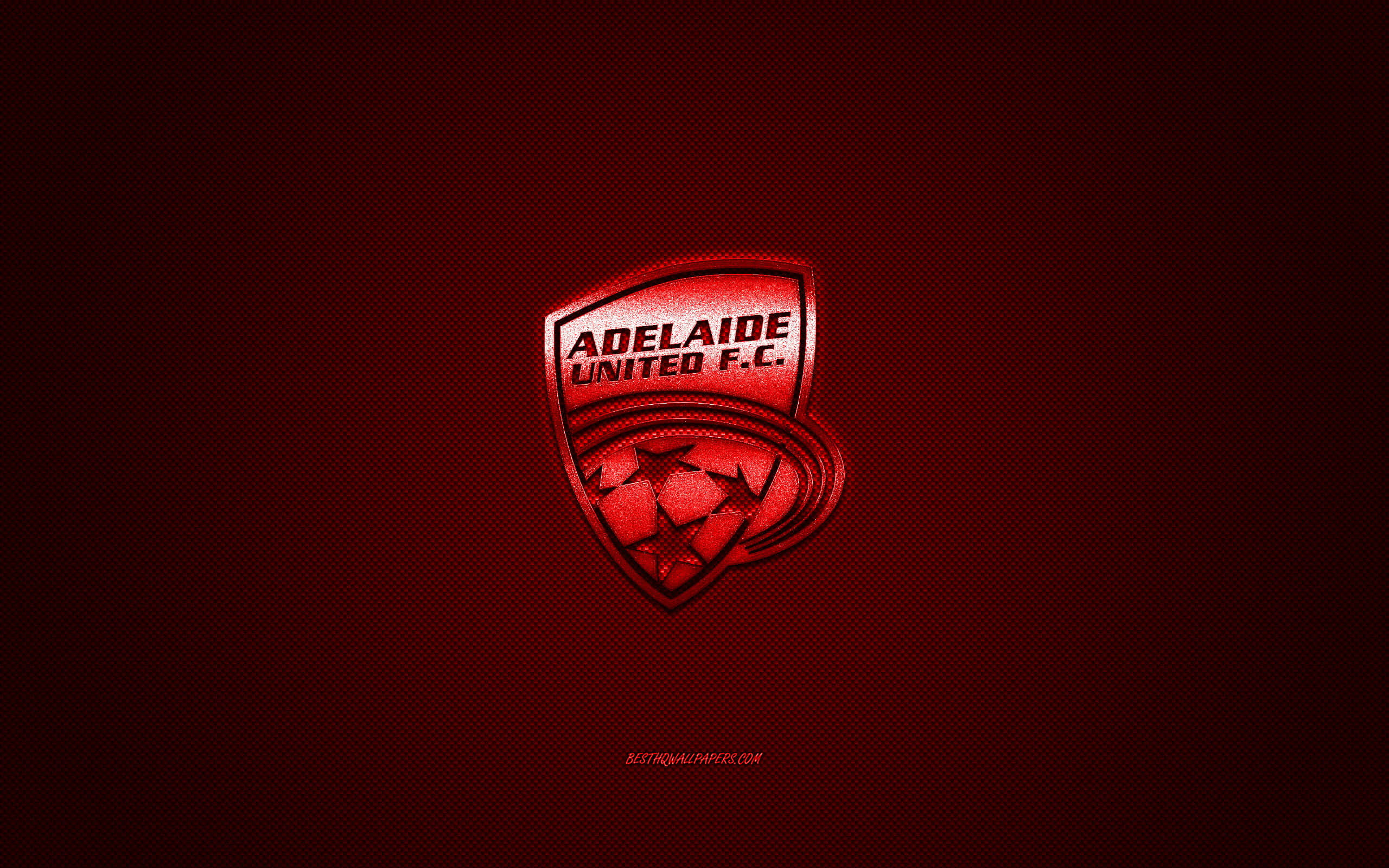 Adelaide United 桌布 壁紙 — 發光的紅色阿德萊德聯足球俱樂部隊徽，居中放置在帶紋理的深紅色背景上。