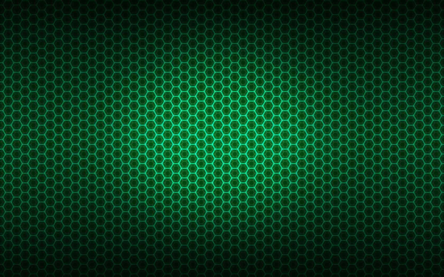 Digital 桌布 壁紙 — 發光的綠色六邊形網格從中心向外輻射，在深色背景上形成未來感的數位圖案。