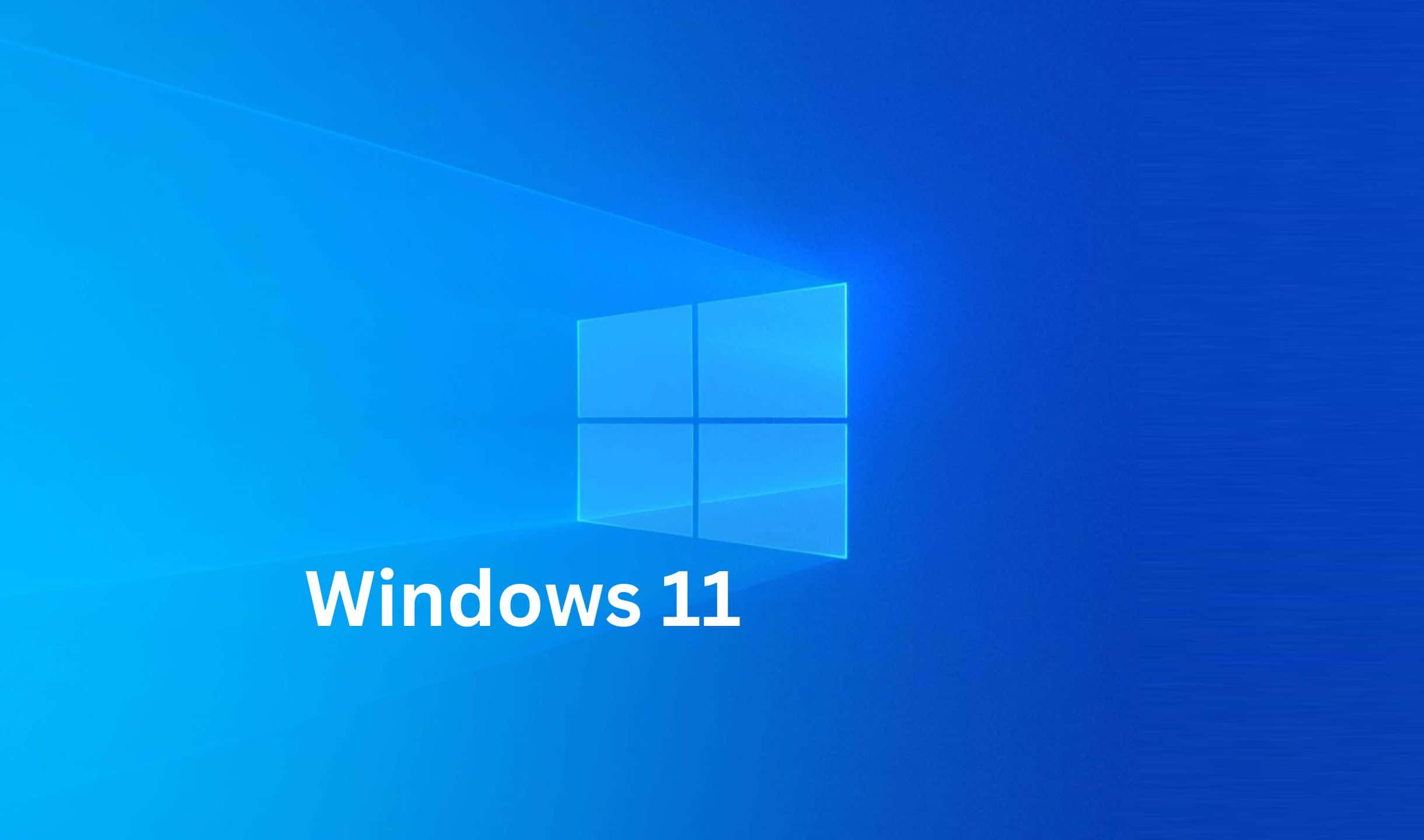 Windows 11 桌布 壁紙 — 發光的藍色Windows 11標誌漂浮在漸變藍色數位空間中，帶有柔和的光線。