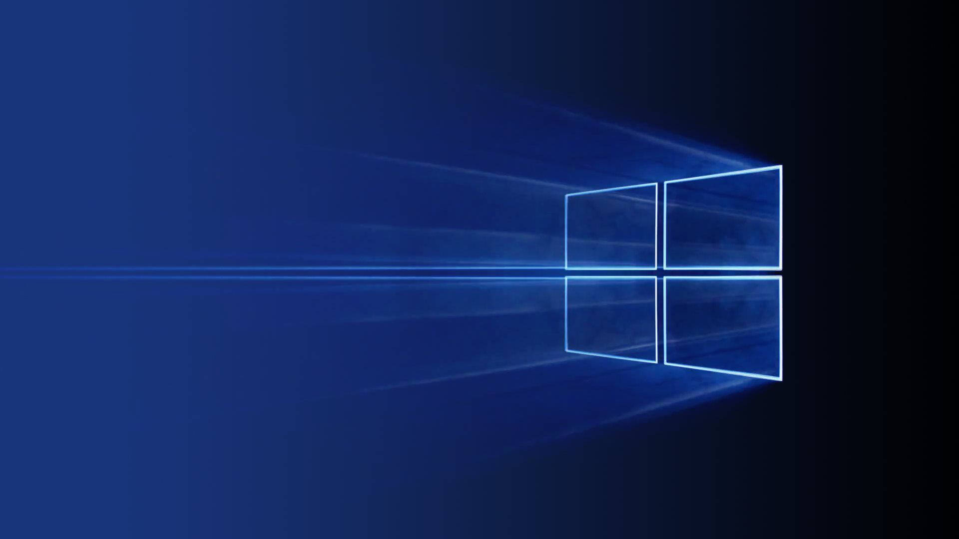 發光藍色Windows標誌在深色背景上帶有光束 — Microsoft 壁紙