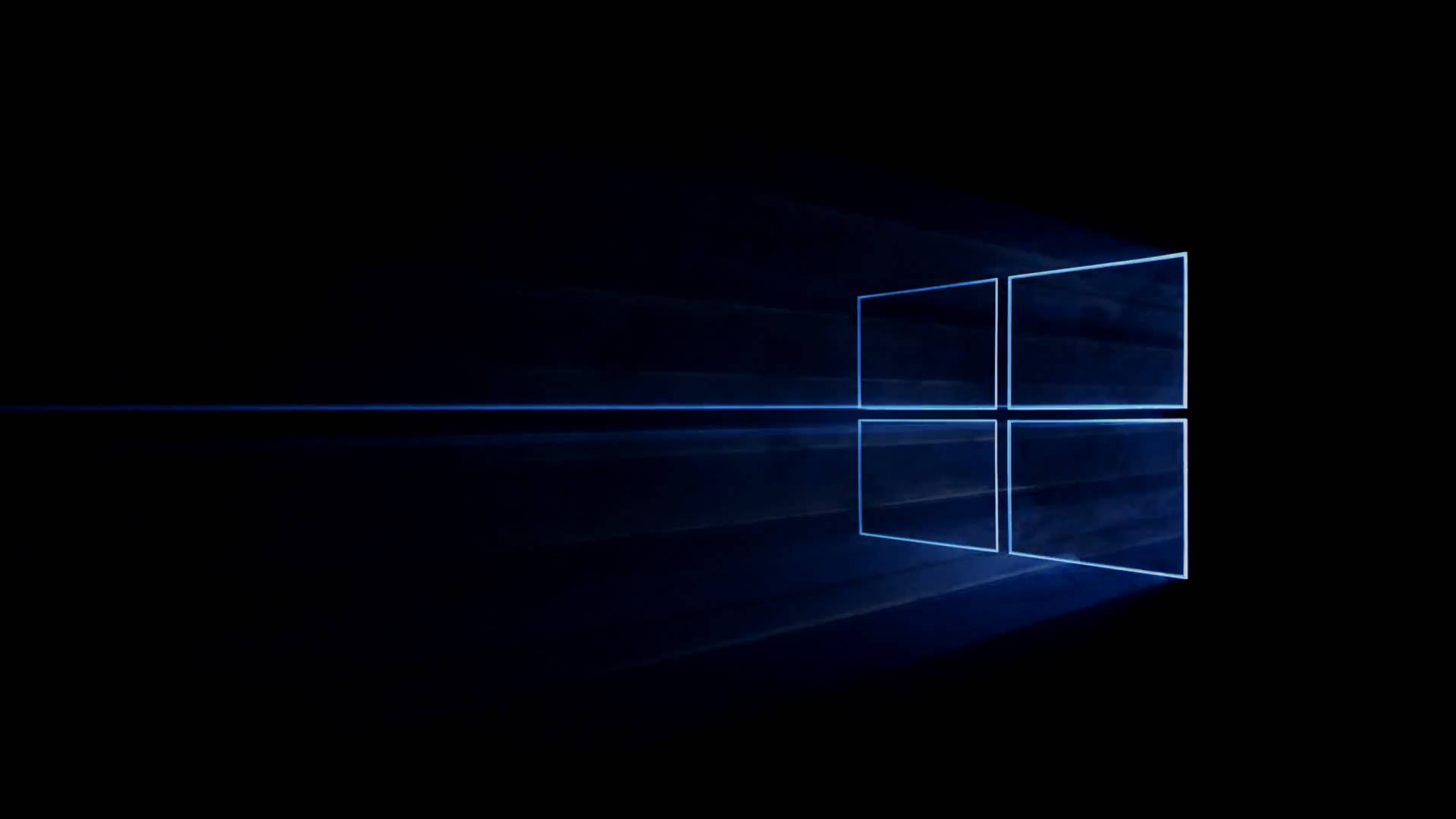 黑暗背景中帶有光線的發光藍色Windows標誌 — Microsoft 壁紙