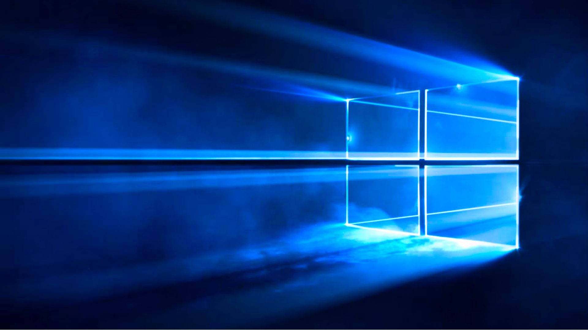Windows 10 桌布 壁紙 — 發光的藍色Windows標誌在黑暗背景上明亮閃耀，光線穿過。