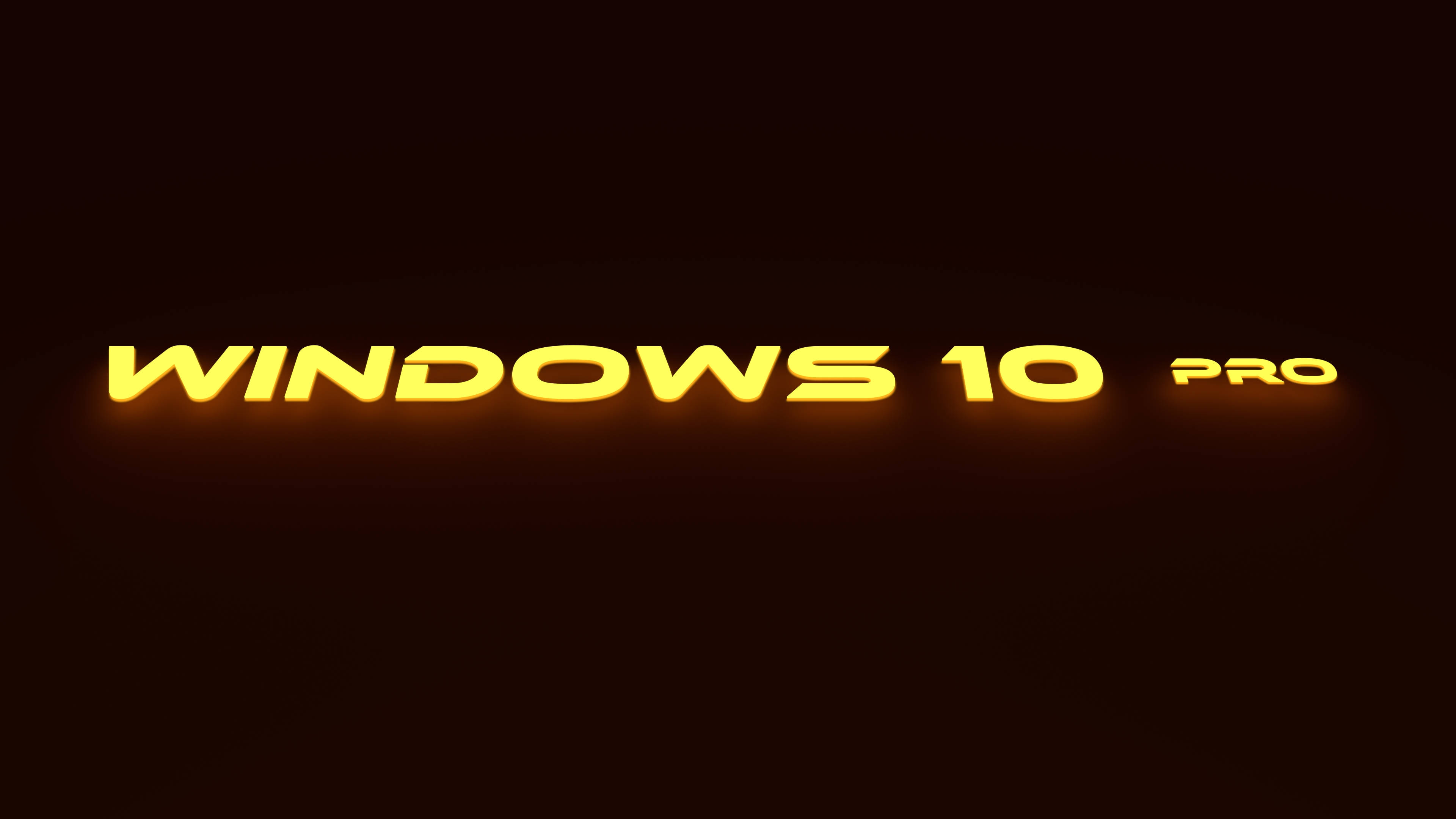 Windows 10 高畫質 桌布 壁紙 — 發光的金色 Windows 10 Pro 文字在黑暗背景上漂浮，帶有柔和環境光。