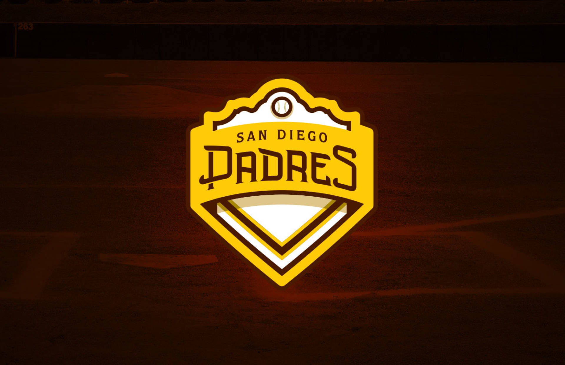Padres 桌布 壁紙 — 發光的黃色聖地牙哥教士隊標誌在深色木質表面上明亮閃耀。