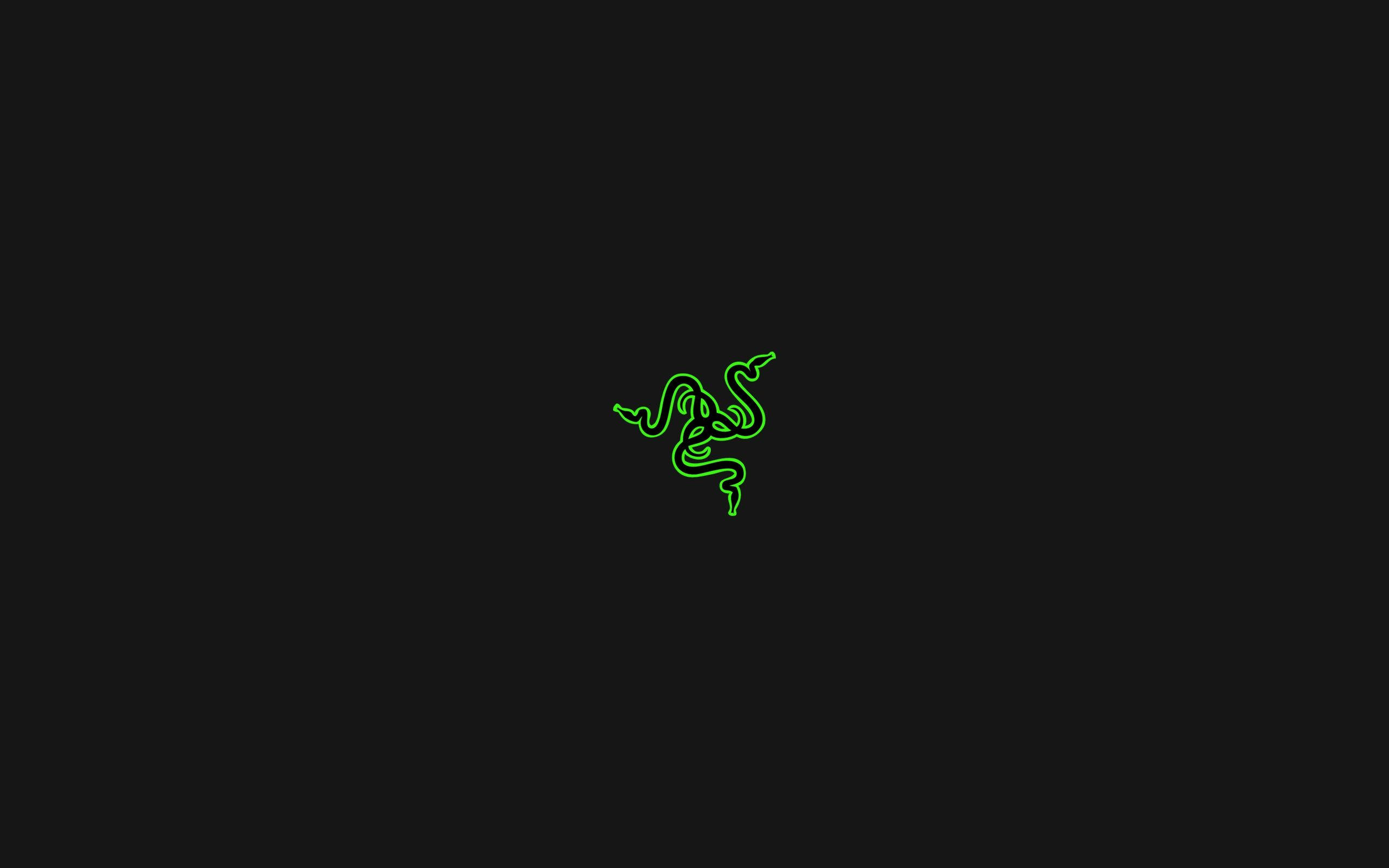 雷蛇 桌布 壁紙 — 發光綠色Razer標誌居中於純黑色背景上。
