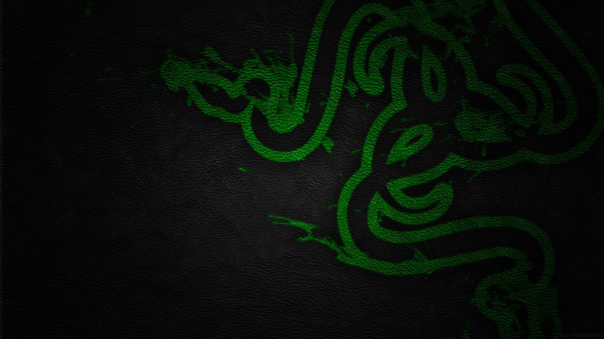 Razer Pc 桌布 壁紙 — 發光綠色Razer標誌蝕刻在深色紋理皮革上，帶有微妙的燈光高光。