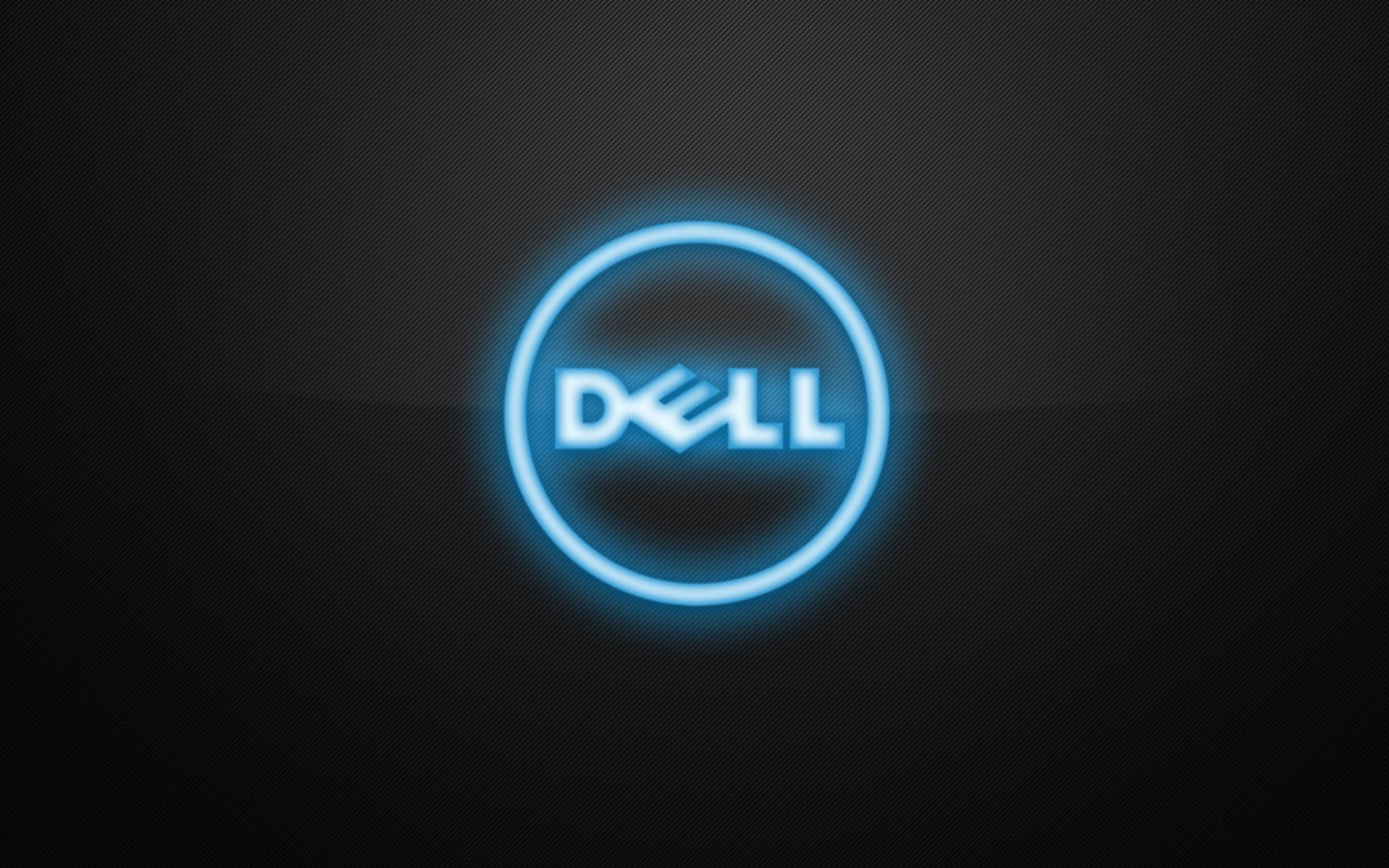 Dell 桌布 壁紙 — 發光藍色Dell標誌居中於帶有微妙漸變照明的深色紋理背景上。