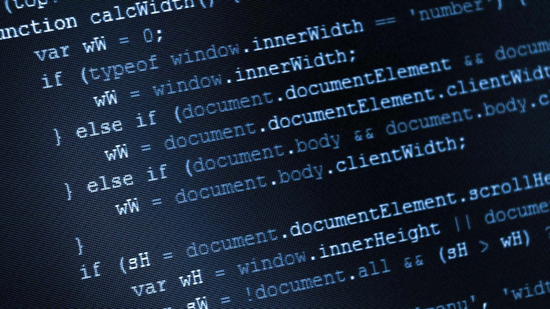 資訊科技 桌布 壁紙 — 發光藍色JavaScript程式碼在暗色電腦顯示器螢幕上滾動的特寫。