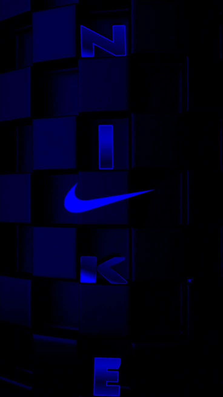 Blue Nike 桌布 壁紙 — 發光藍色Nike標誌從黑暗立方體中浮現，在未來數位網格中。
