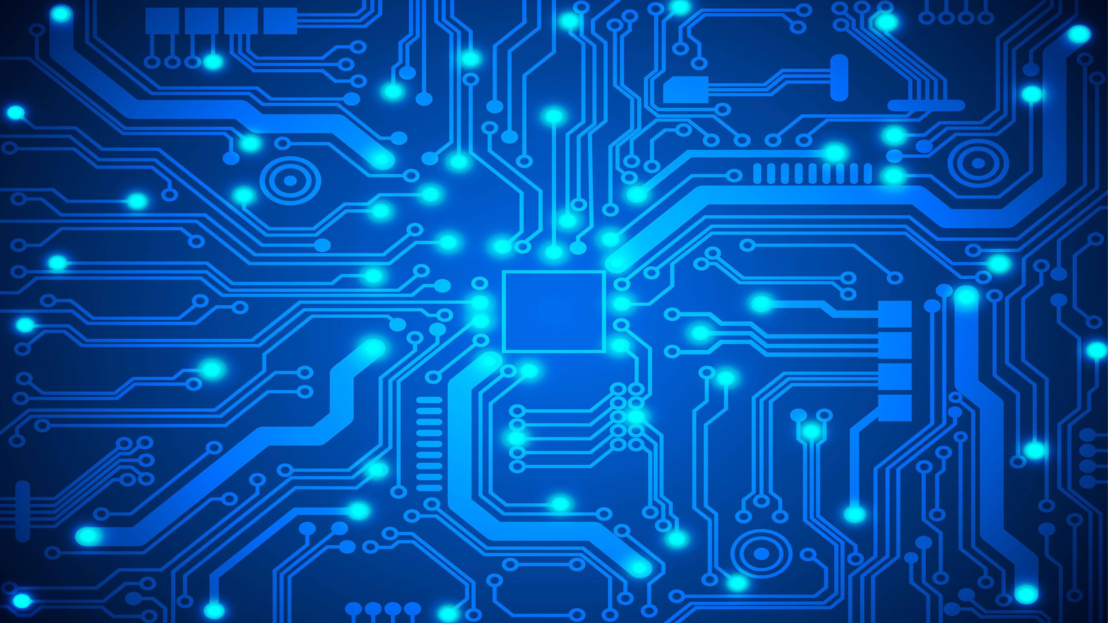 Circuit 桌布 壁紙 — 發光藍色電路板，帶有複雜路徑和從中央晶片輻射的照明節點。