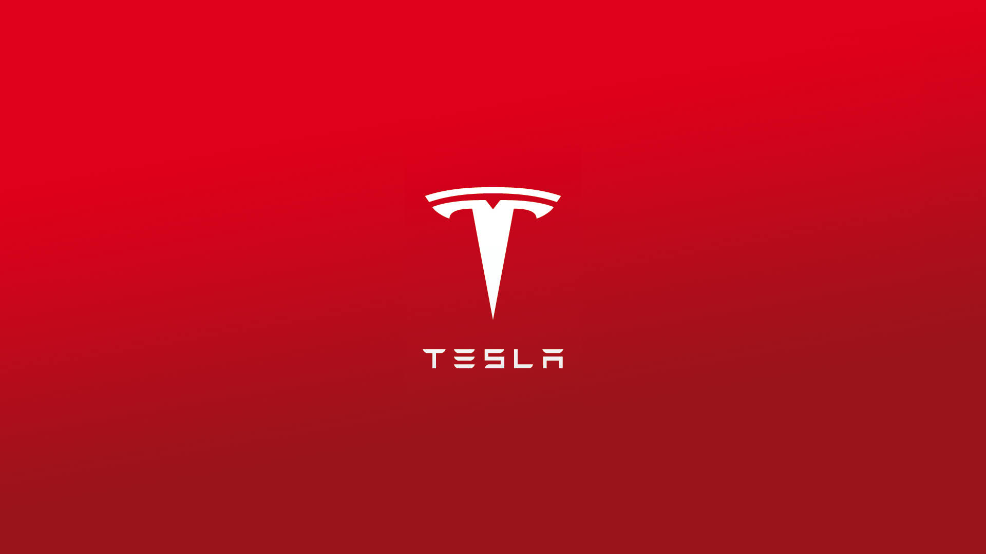 特斯拉 桌布 壁紙 — 白色 Tesla 標誌居中於漸變紅色背景上，設計簡潔極簡。