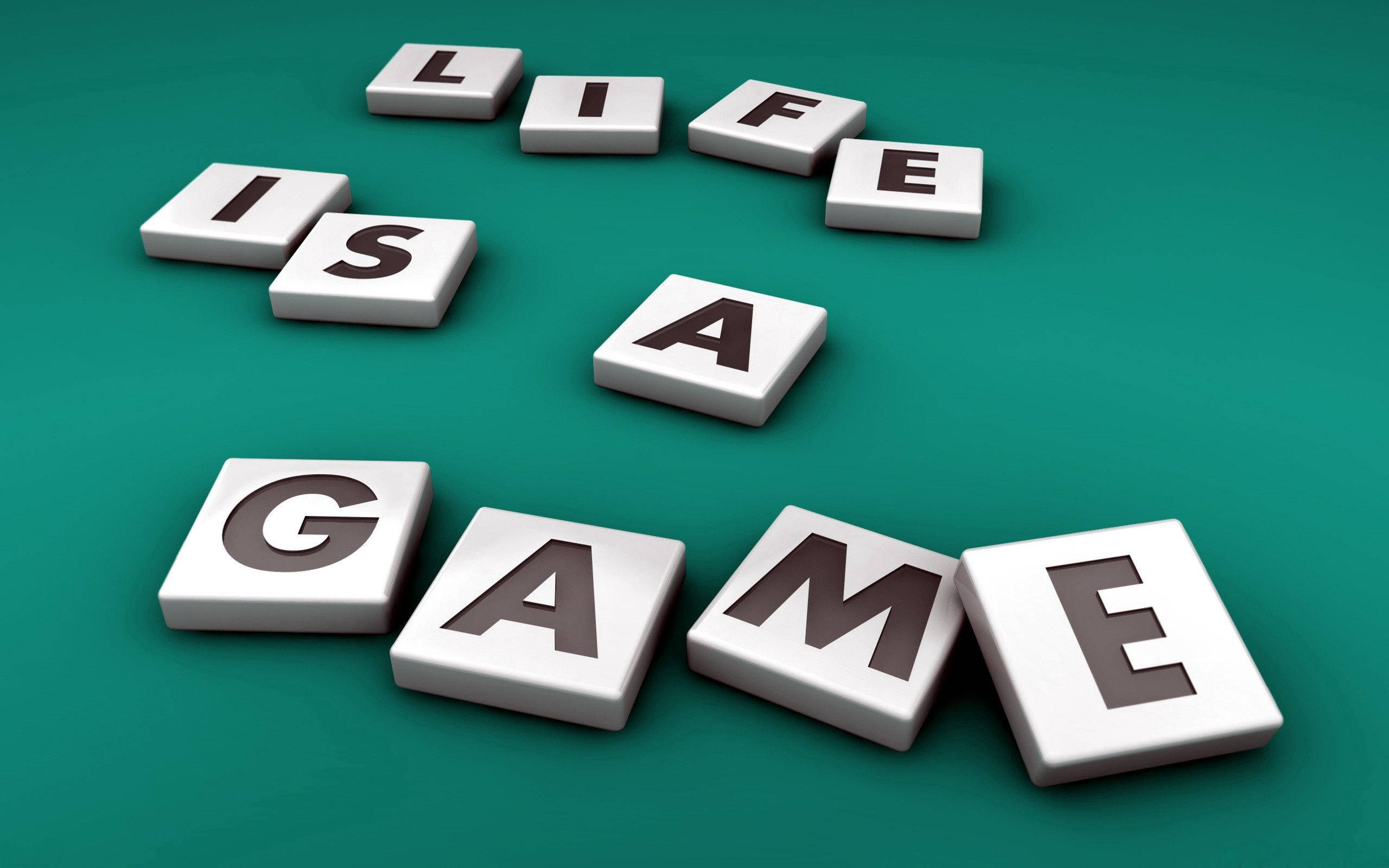 game 桌布 壁紙 — 白色3D字母積木在青綠色表面上拼出「LIFE IS A GAME」，帶有柔和陰影。