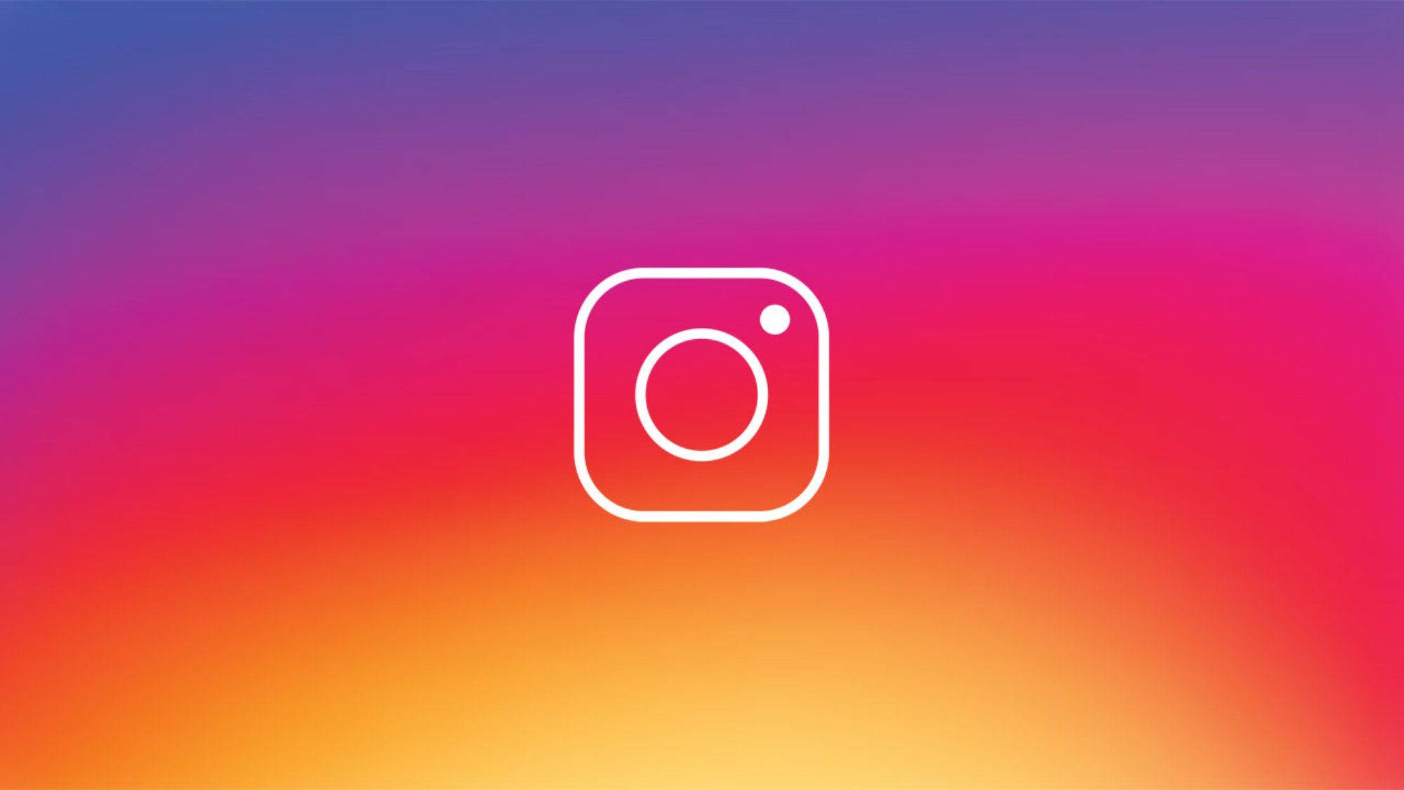 Instagram 桌布 壁紙 — 白色Instagram標誌居中於從紫色到粉紅色到橙色的鮮豔漸變背景上。