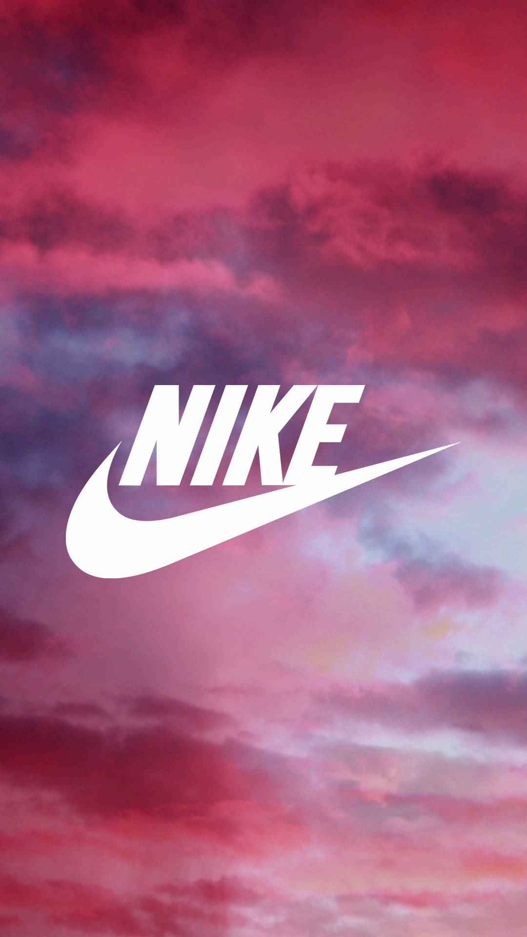 nike girl 桌布 壁紙 — 白色Nike標誌漂浮在帶有漩渦雲彩的戲劇性粉紅紫色日落天空上。