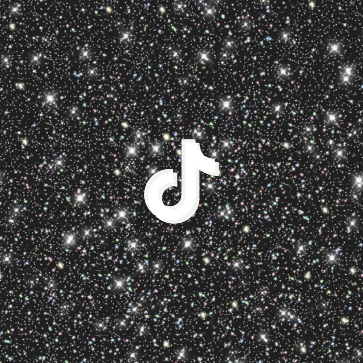 TikTok 動圖 桌布 壁紙 — 白色TikTok標誌置於閃爍宇宙背景中央，背景佈滿閃耀的多彩星星。