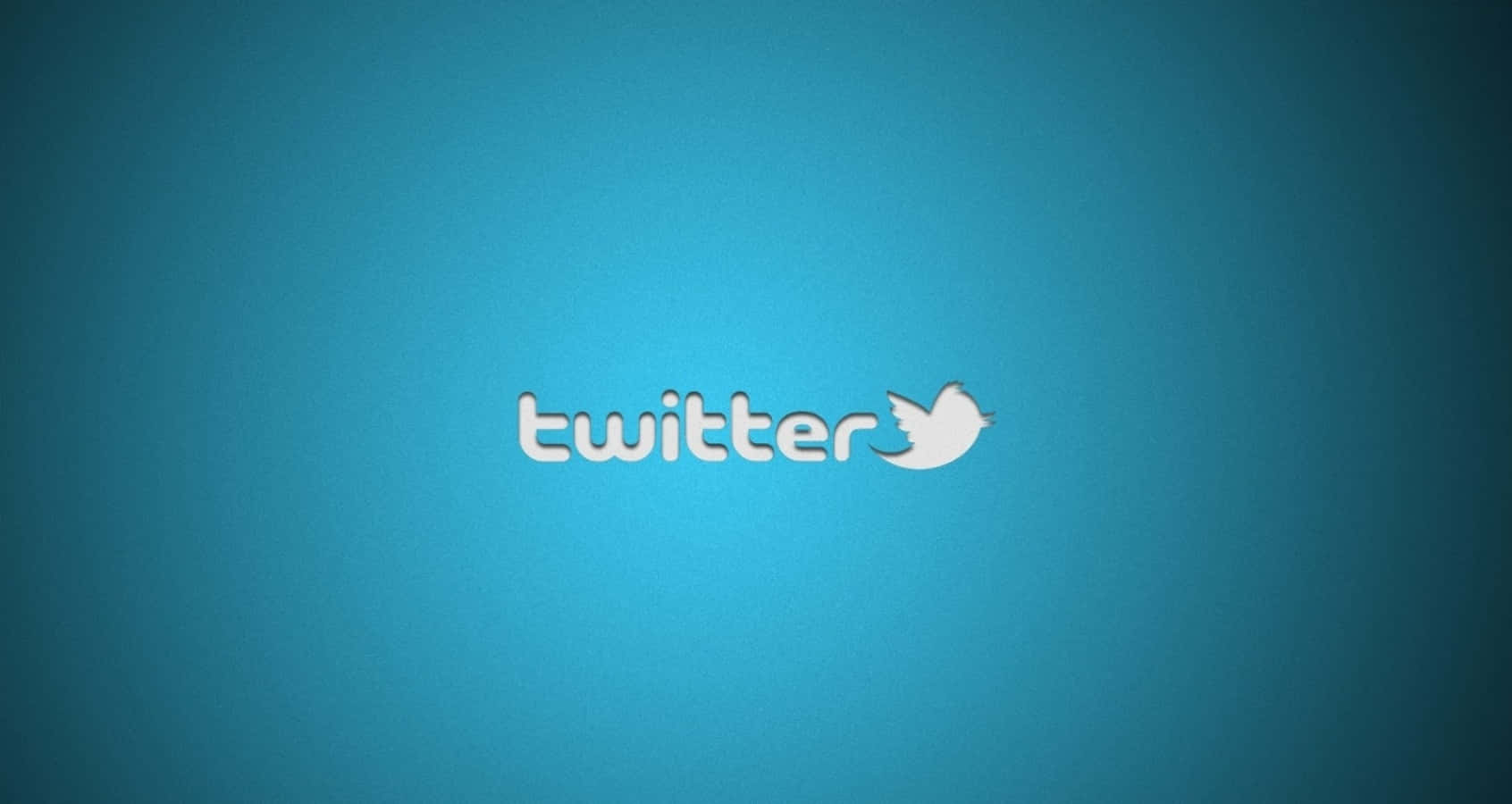 Twitter 桌布 壁紙 — 白色Twitter標誌居中於純藍色漸變背景上。