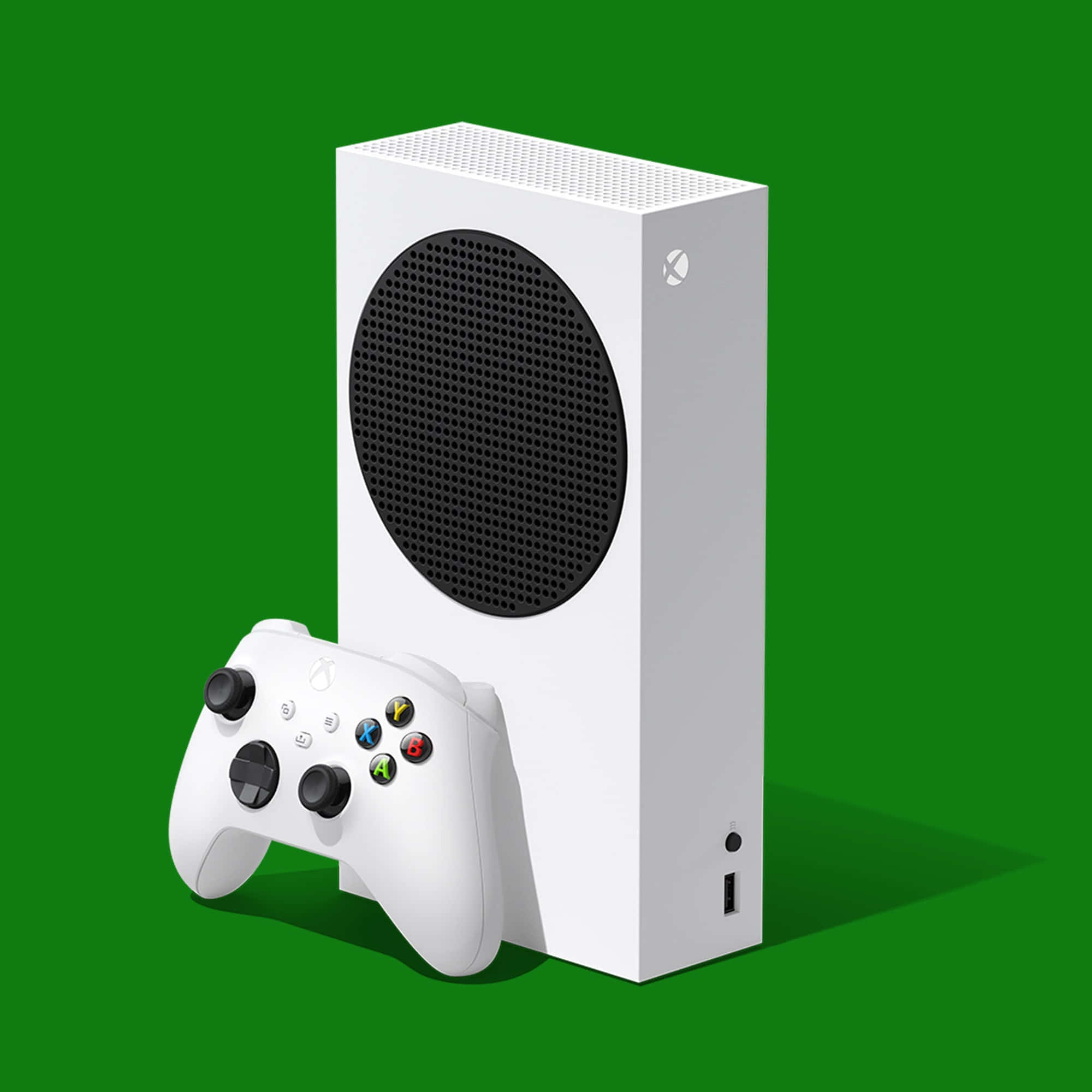Xbox 桌布 壁紙 — 白色Xbox Series S主機和控制器，在純綠色背景上帶有柔和陰影。