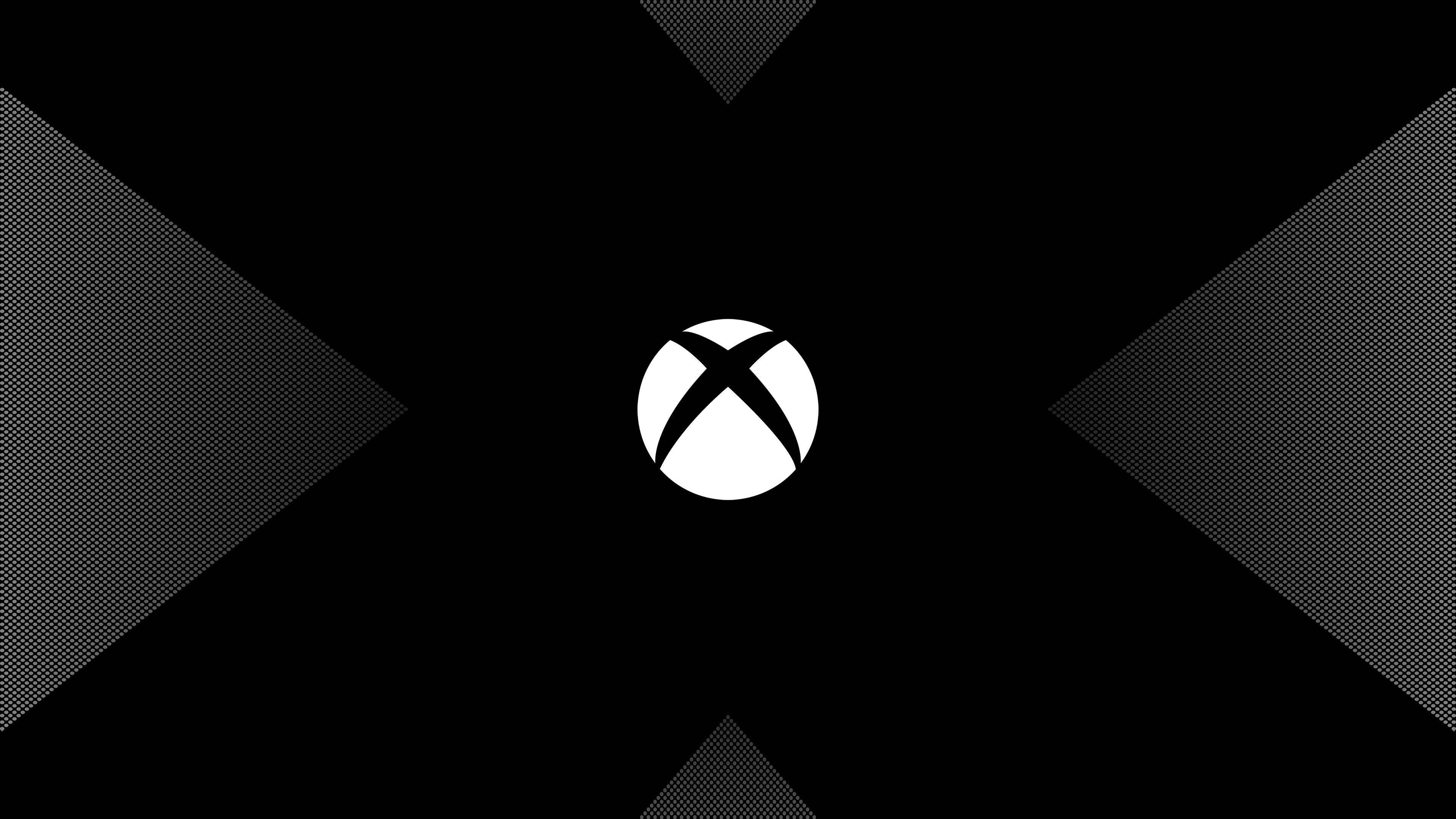 X 桌布 壁紙 — 白色Xbox標誌居中於黑色背景上，帶有向外輻射的半色調漸變三角形。