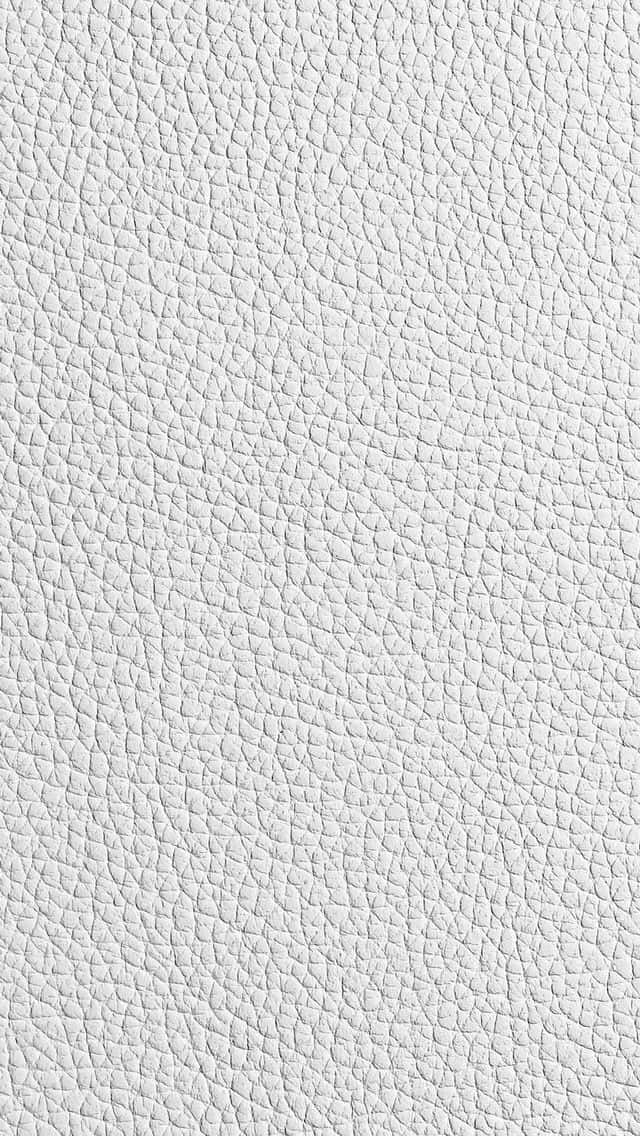 texture 桌布 壁紙 — 白色卵石紋皮革質感的特寫，帶有細微的縫線細節和柔軟的自然紋理圖案。