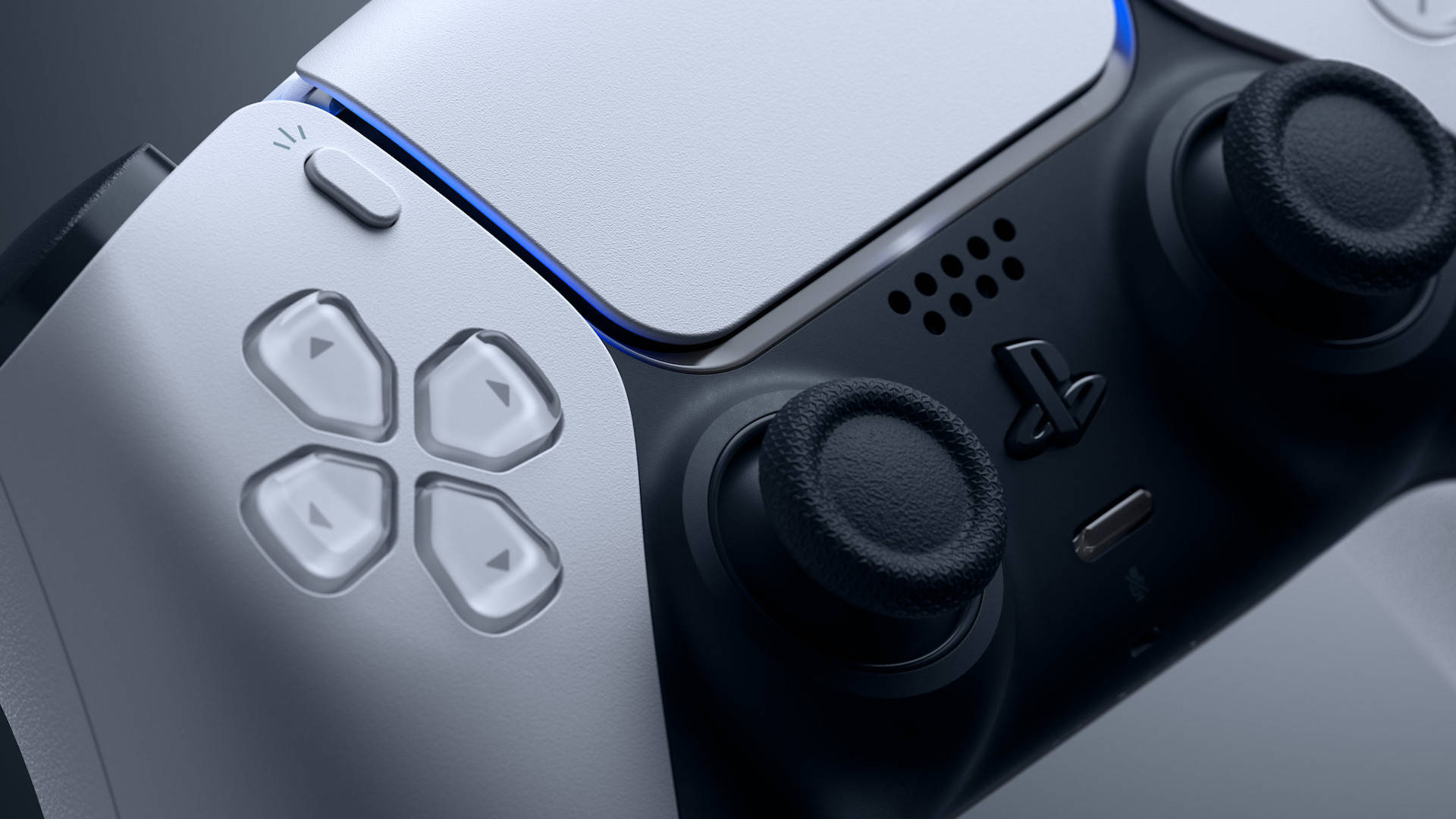 PS5 動態圖片 桌布 壁紙 — 白色和黑色光滑 PlayStation 5 控制器的特寫，帶有發光的藍色燈光點綴。