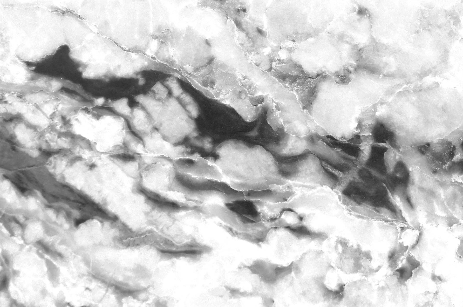 Marble Desktop 桌布 壁紙 — 白色和黑色漩渦大理石的近距離特寫，帶有有機紋理和光澤質感。