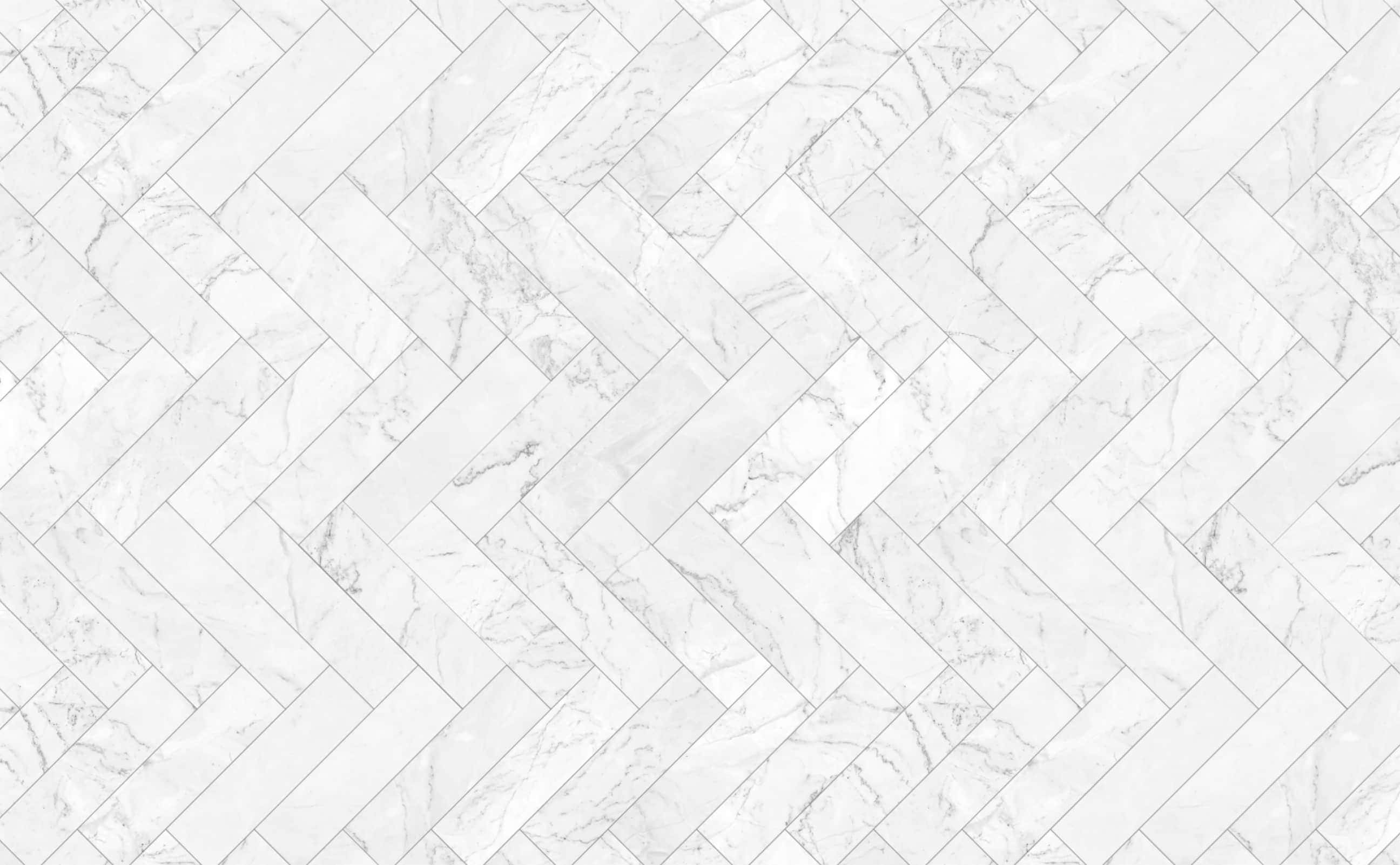 Tiles 桌布 壁紙 — 白色大理石瓷磚以人字形圖案排列，營造出乾淨優雅的地板質感。