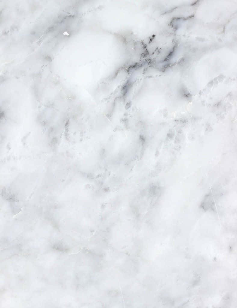 Aesthetic Gray Marble 桌布 壁紙 — 白色大理石的特寫，帶有漩渦狀灰色紋理和細微質感。