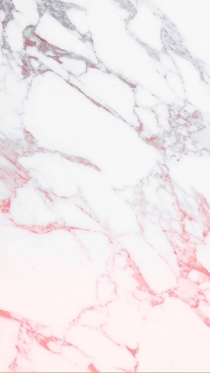 Pink Marble 桌布 壁紙 — 白色大理石的特寫，表面有柔和的粉紅色和灰色紋理以有機圖案流動。